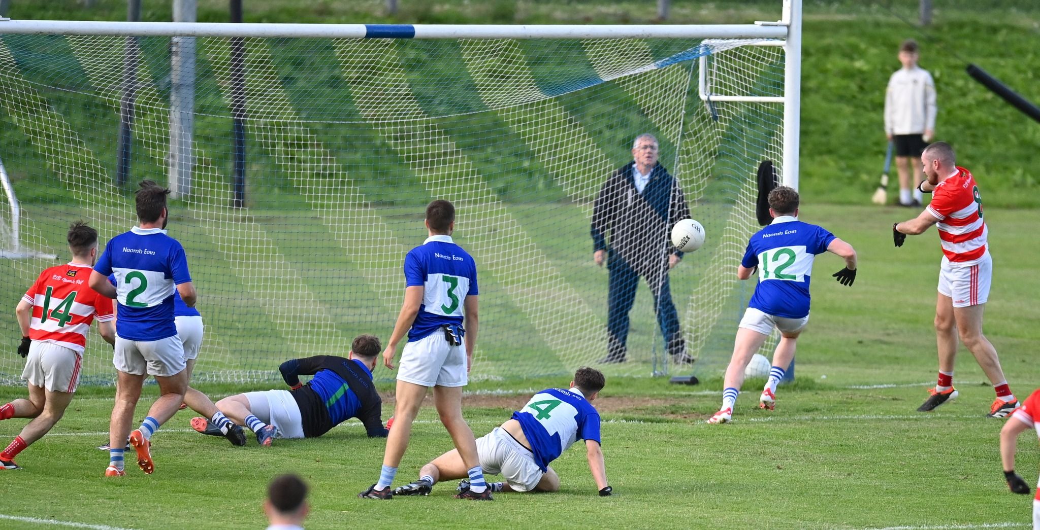Conor Hughes punches a goal for St Paul's