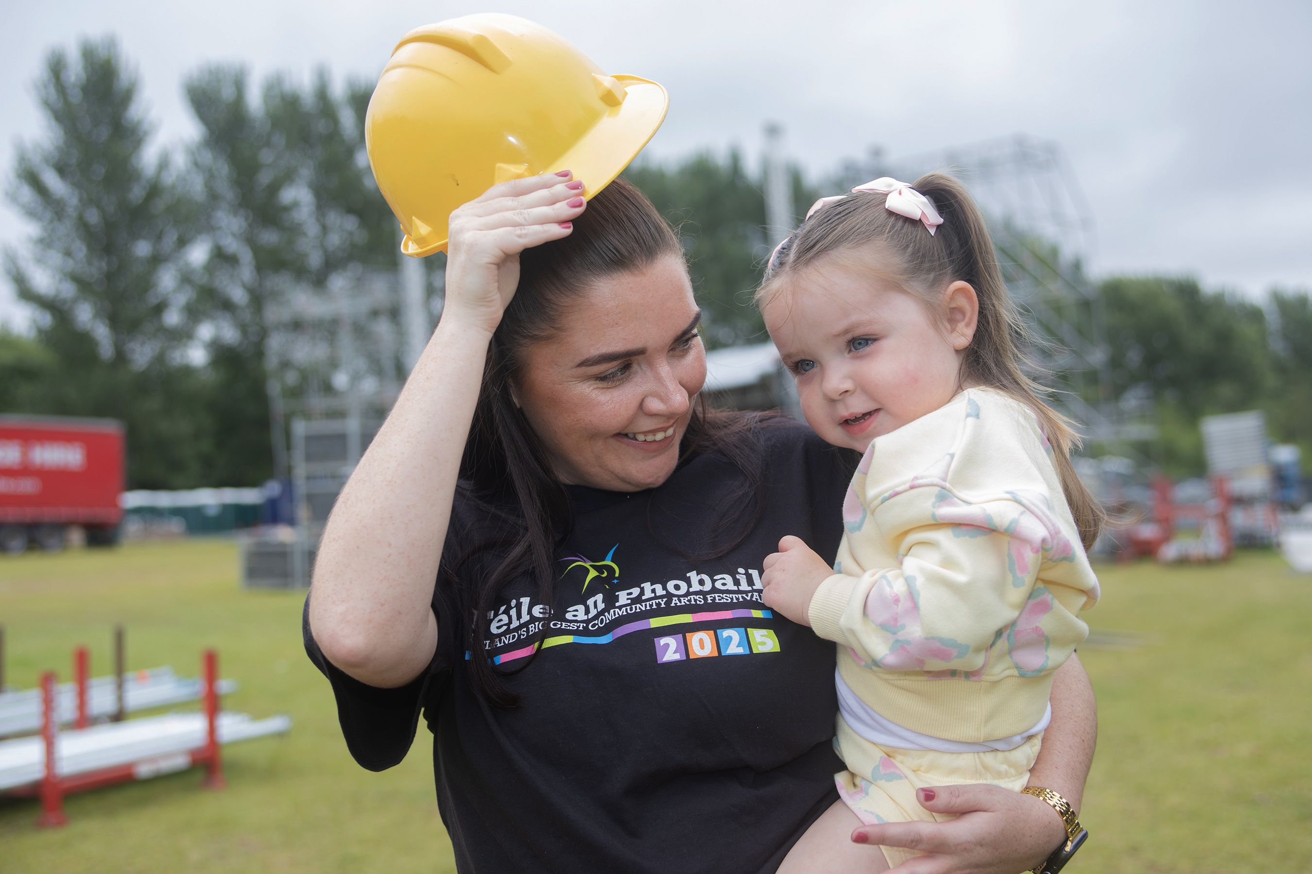 Lauren Slane, Féile an Phobail board member, with her niece Croia Slane at the Falls Park concert arena as work progresses ahead of this week’s concerts