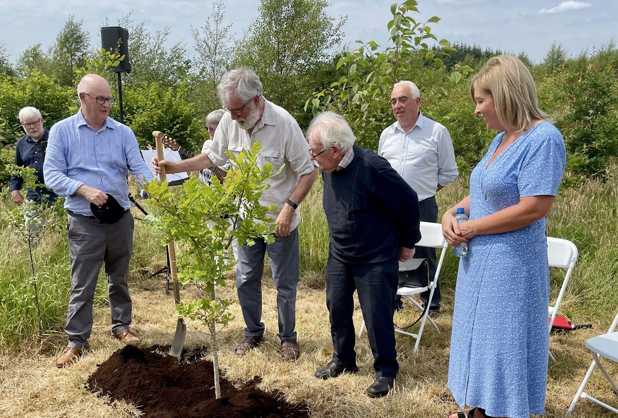 NATIVE: Gerry Adams and Martin Neary plant an oak tree on land Martin has made into woods
