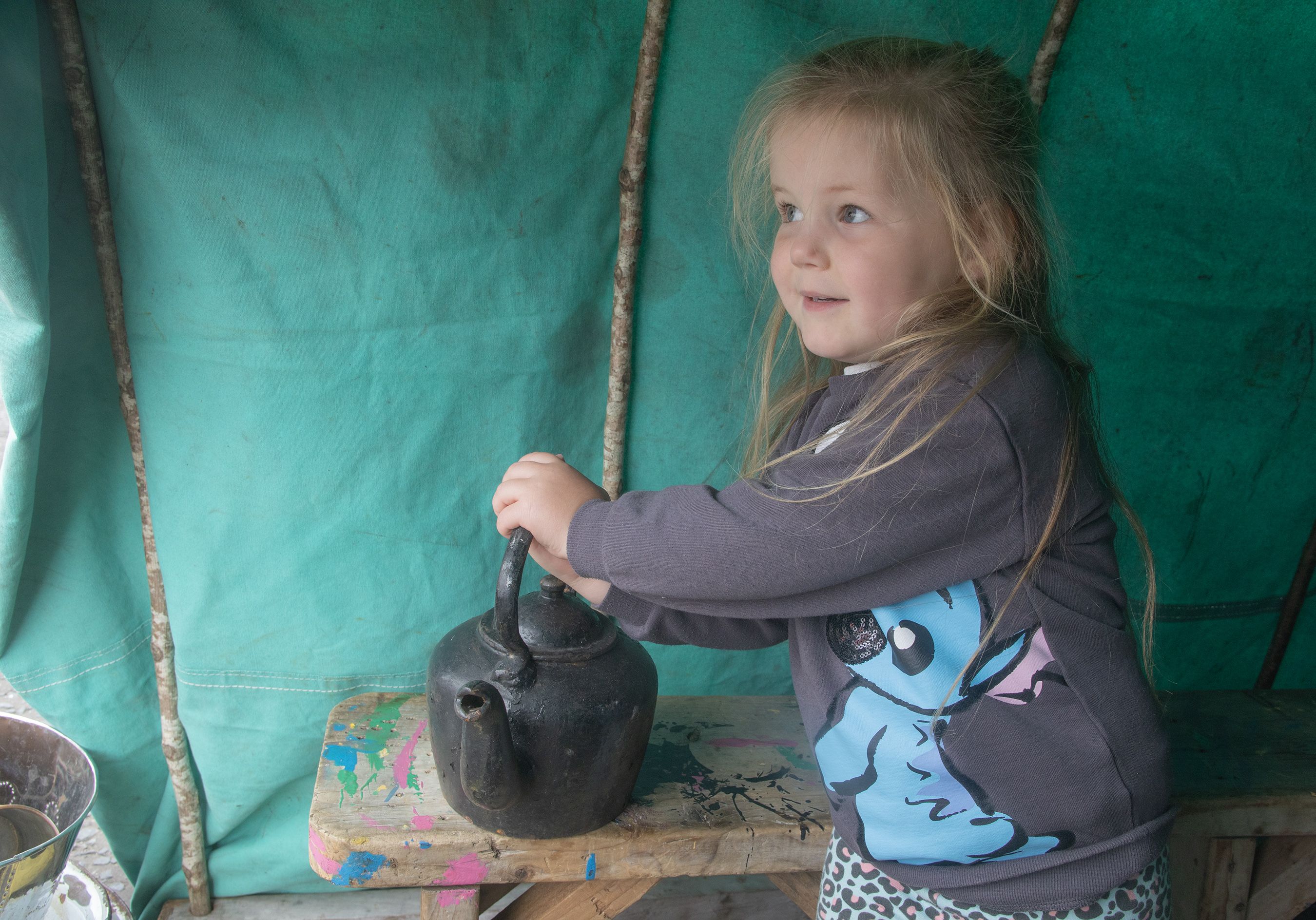 Fiadh Walsh playing with the stove and teapot