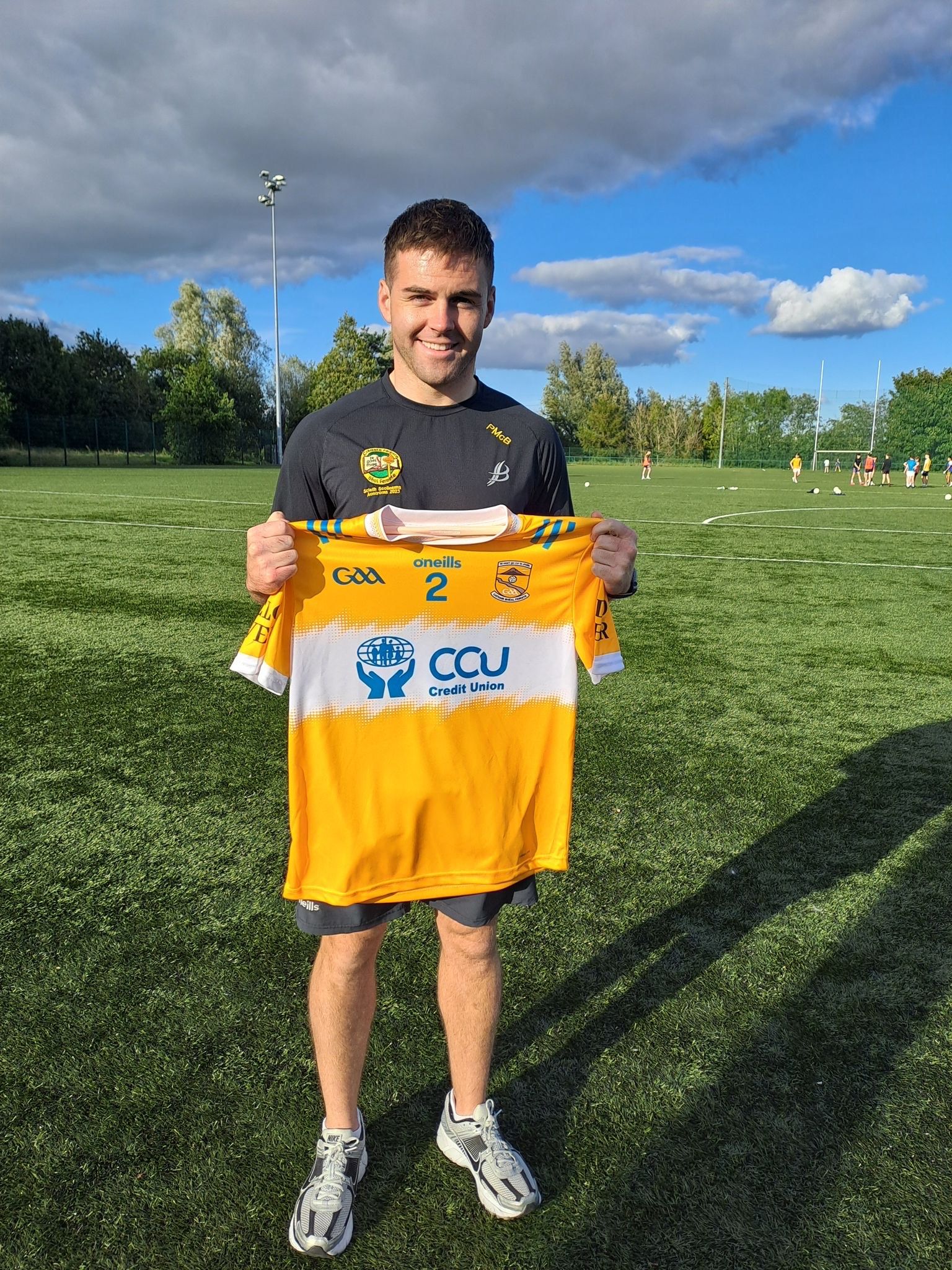 Coláiste Feirste teacher Paddy McBride with the new jersey