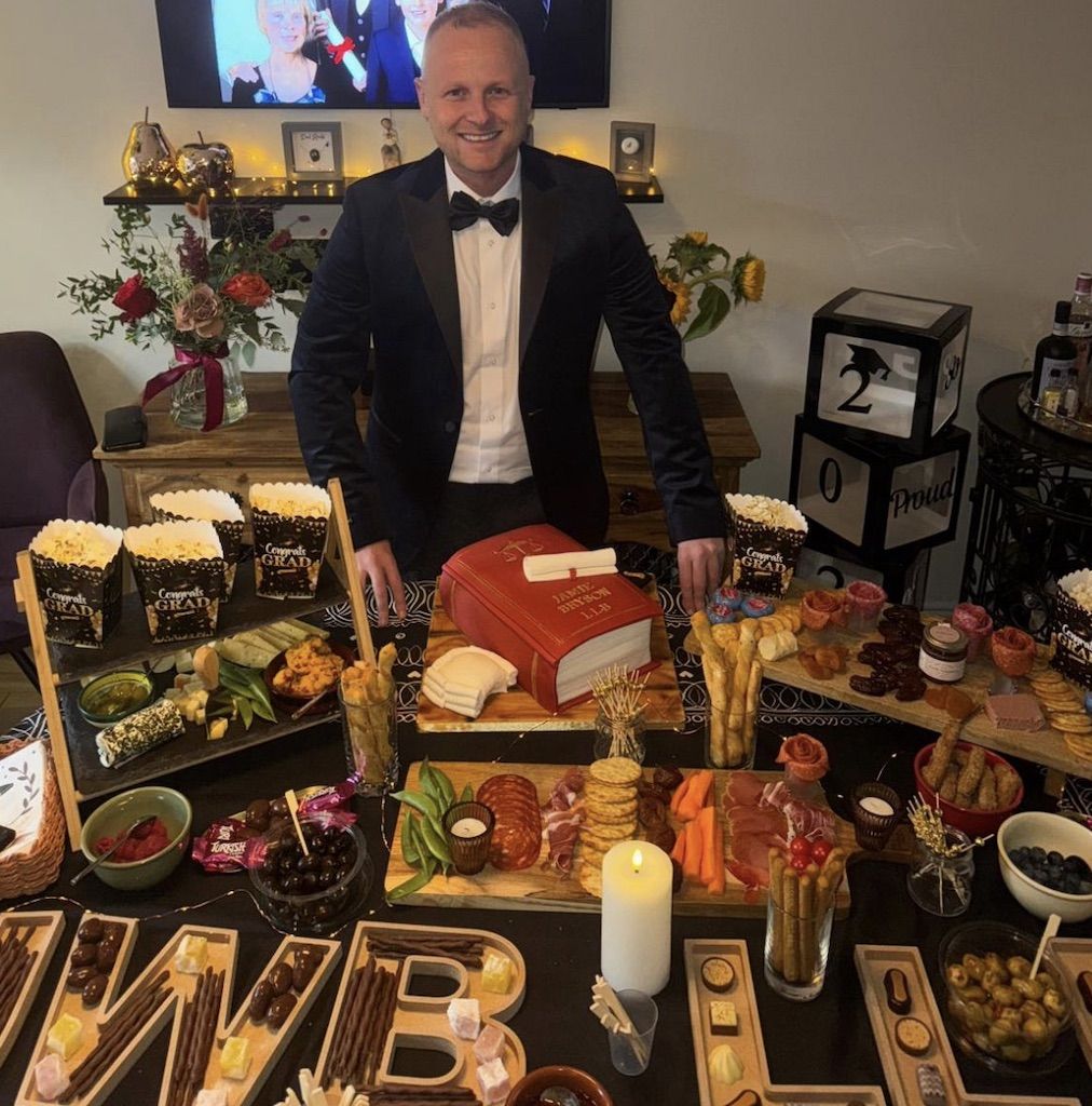 TABLE TALK: Jamie Bryson celebrates his LLB with finger good and (below) a UVF certificate of proficiency