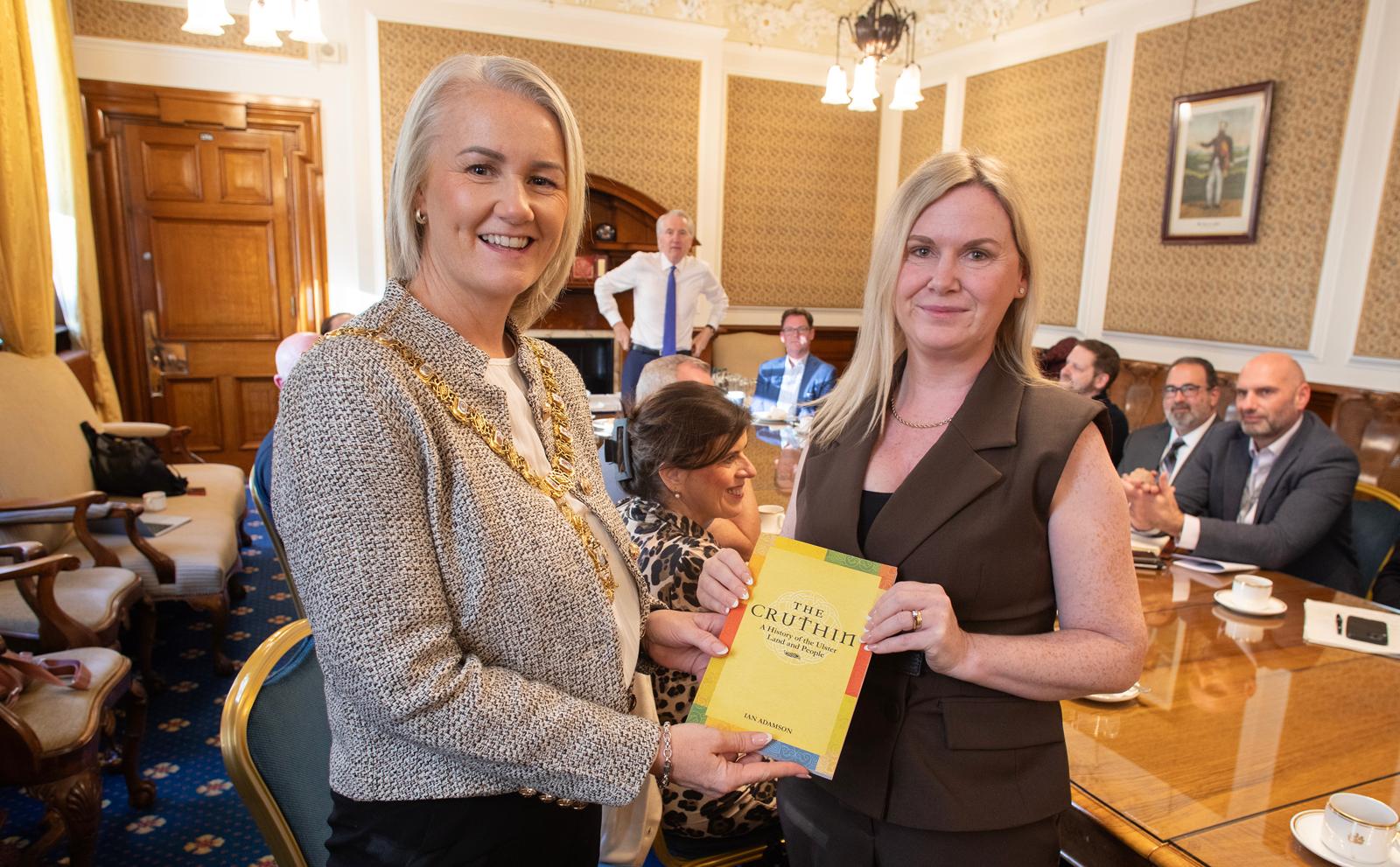 BOOKED: Lord Mayor Tracy Kelly hosted Homecoming guests in City Hall yesterday for a discussion on the future of Belfast. After the discussion she was presented with a book by Lisa Walsh, formerly of West Belfast and now living in Vancouver