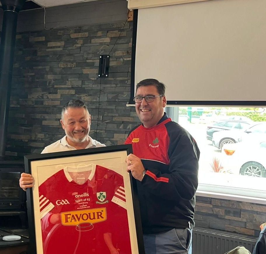 Loughiel's PJ Mullan presents Paddy Tumelty with a jersey