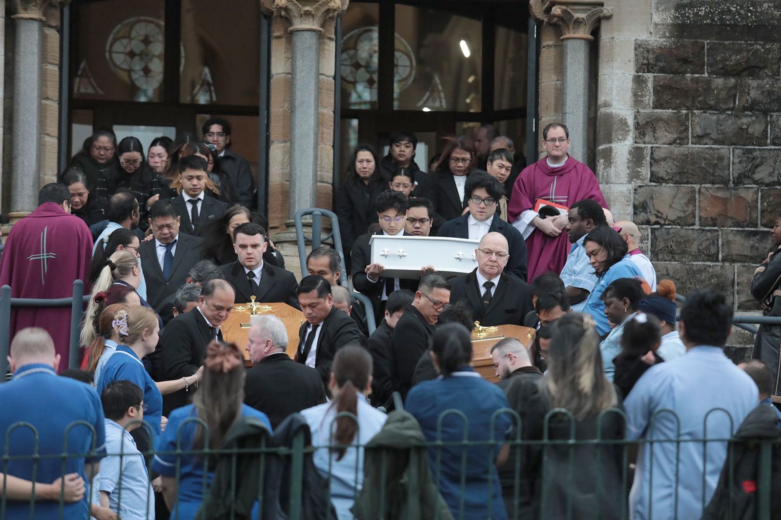 The three coffins leave the St Vincent De Paul Church in Ligoniel