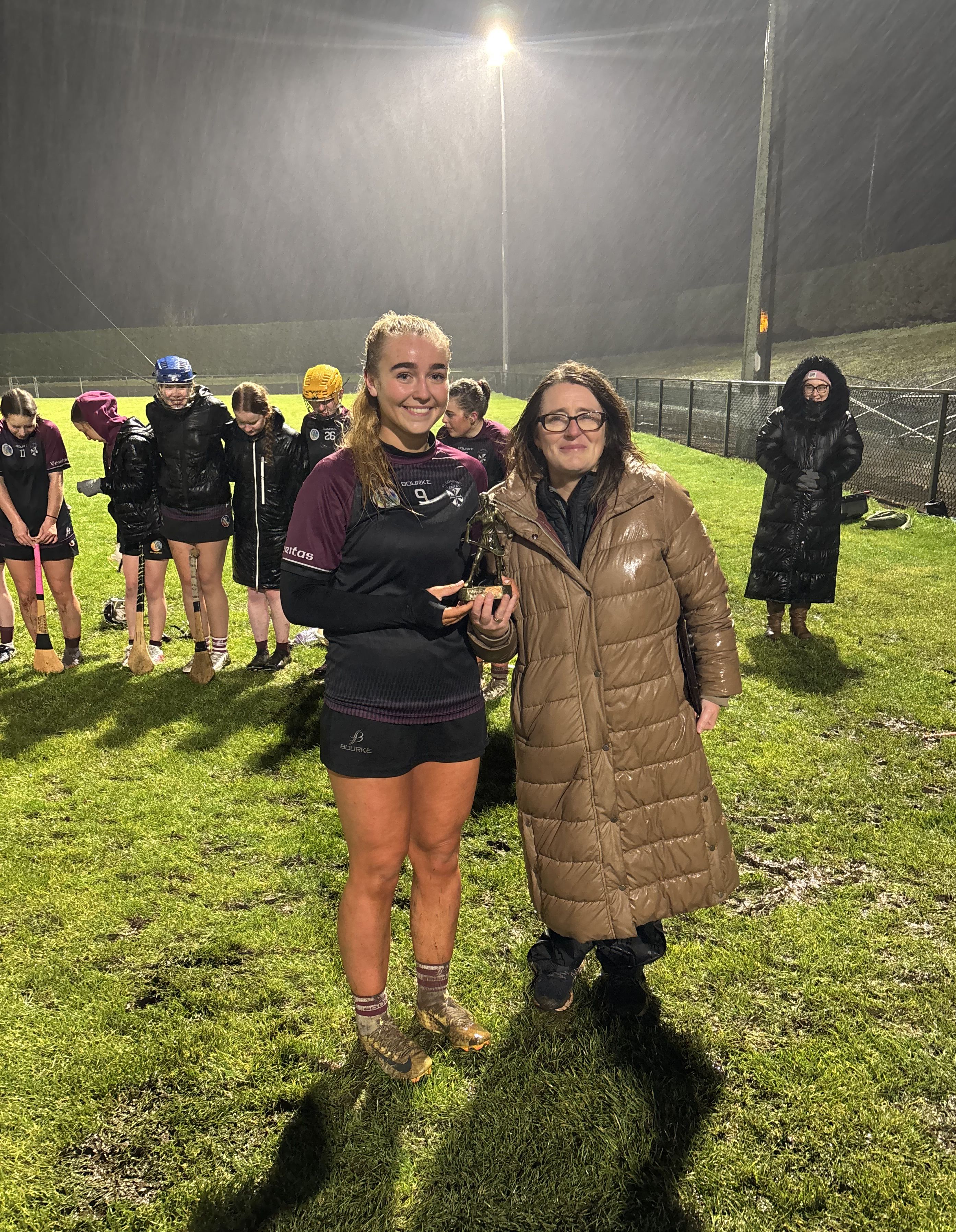 Ulster Schools’ representative Fiona Devlin presents Amelie Annett with the Player of the Match trophy