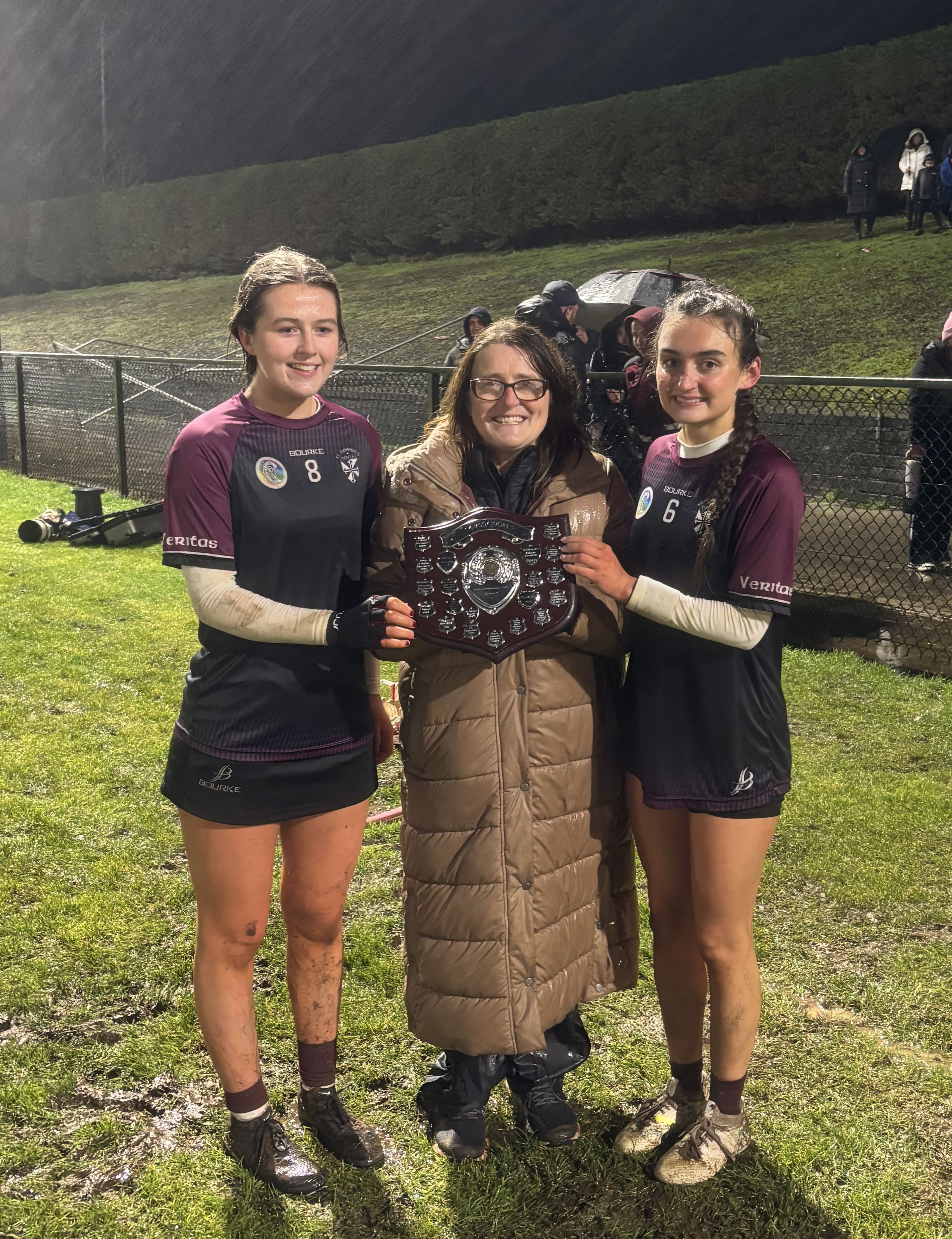 Fiona Devlin presents the Senior Medallion Shield to Maeve Devlin and Cara Lynch 
