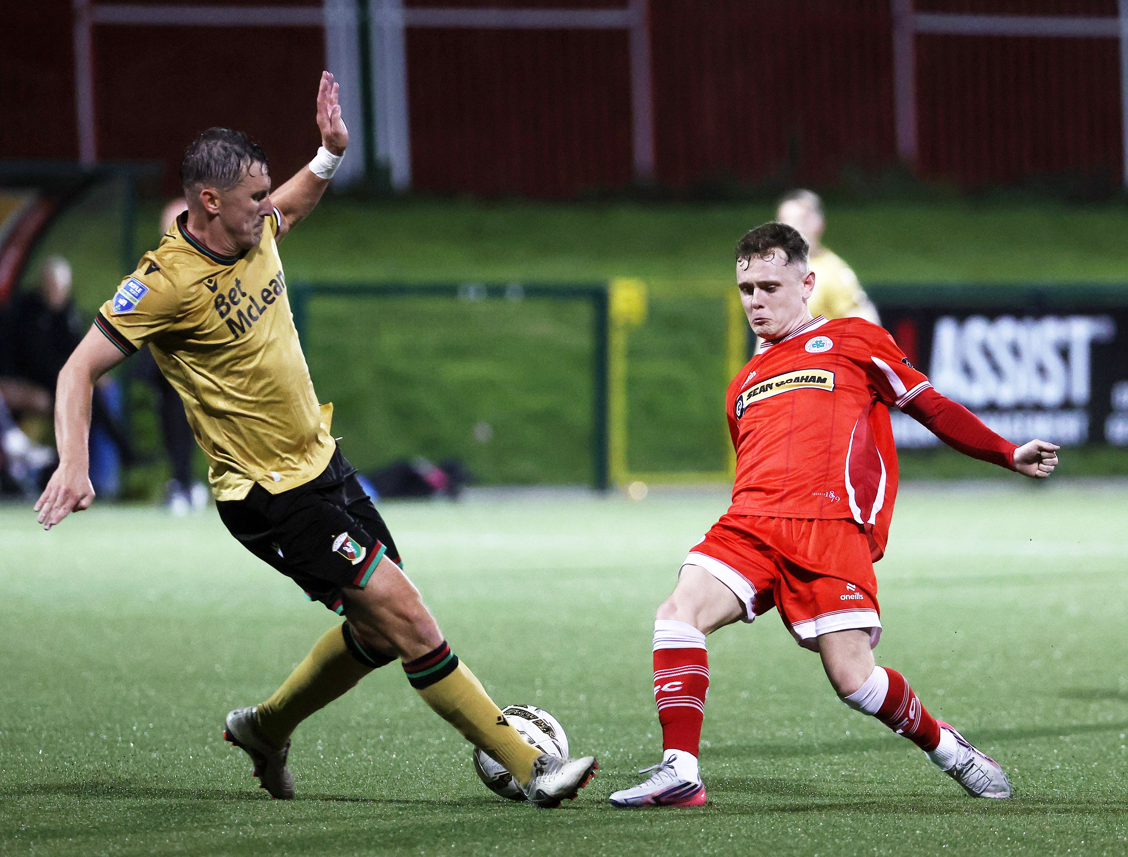 Cliftonville’s Liam McStravick and Glentoran’s Marcus Kane