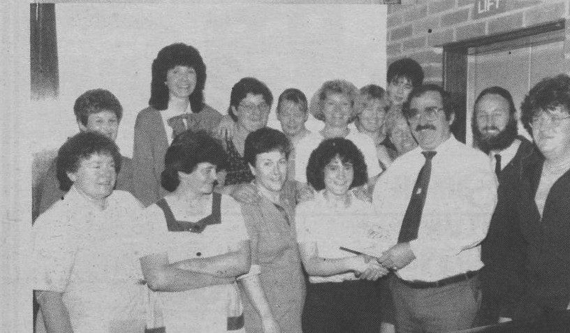 BON VOYAGE: Off on a trip abroad is Maria Hassett and she was given a send off by her colleagues at the Whiterock Leisure Centre back in October 1985. Manager Danny Corrigan presented her with a gift
