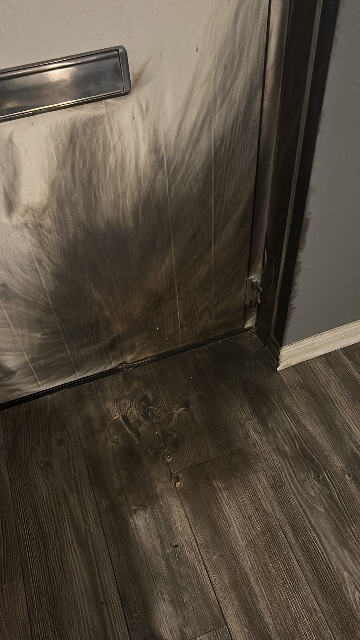 Damage to a door caused by the explosion