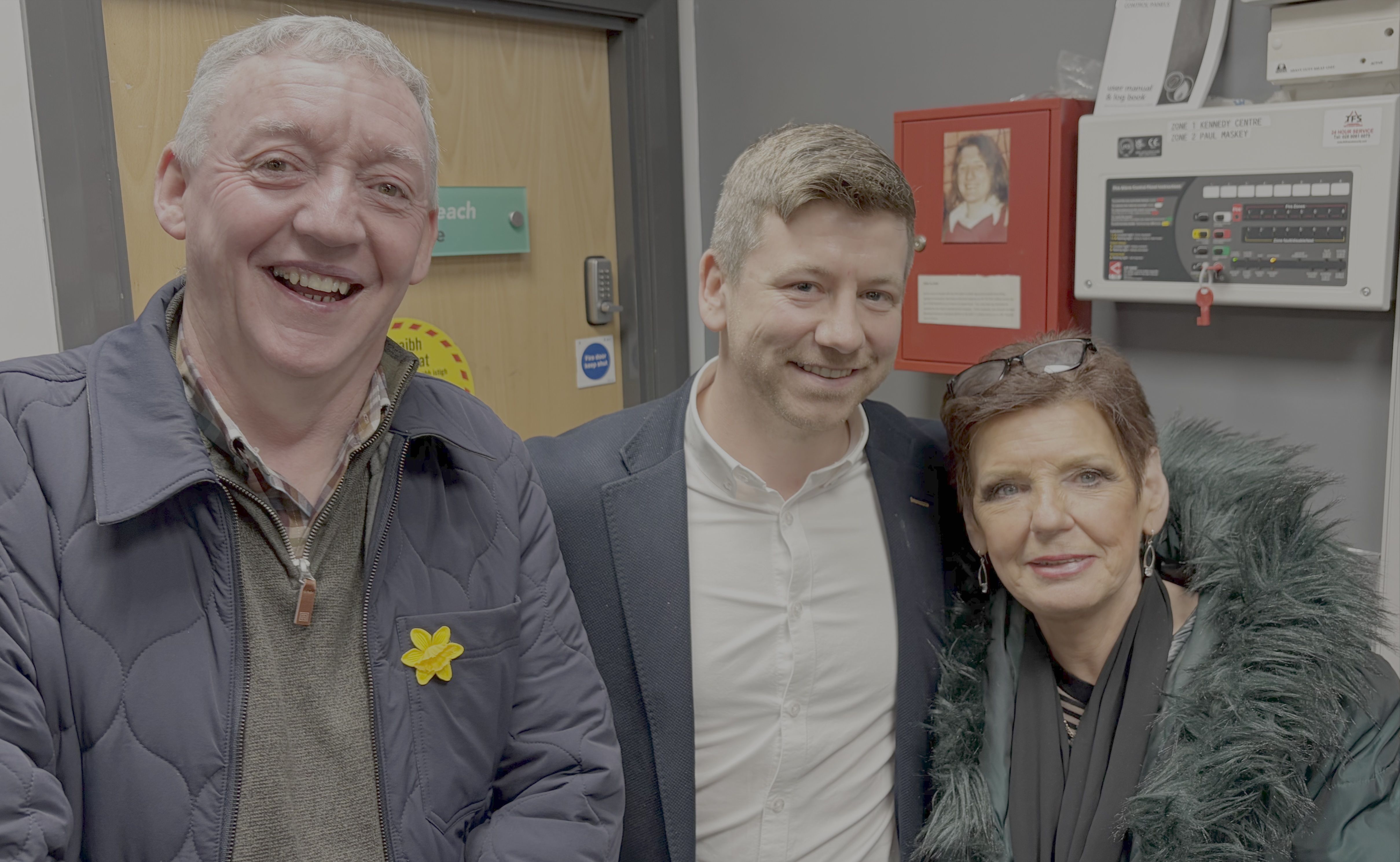 BY GEORGE: Mickey George of Tullymore Community Forum, Mickey Joe Cooper of Cooper's Community Pharmacy and Colin Neighbourhood Partnership and Eileen Hay of Brennan's Irish Linens