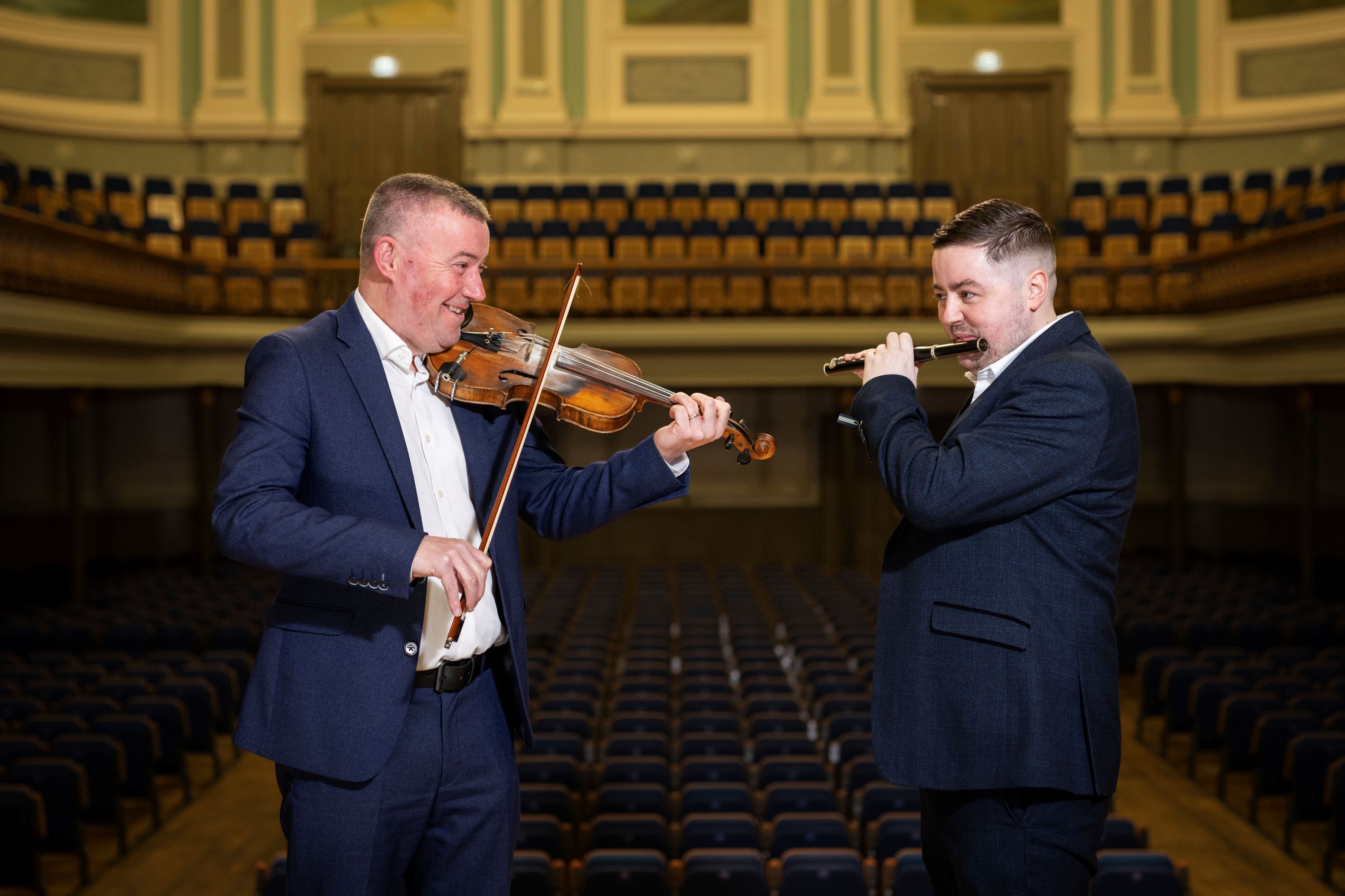 Niall McClean from Ards CCÉ and Darren Leighton from Belfast Bands Forum tune up for two years of Fleadh Cheoil in Belfast