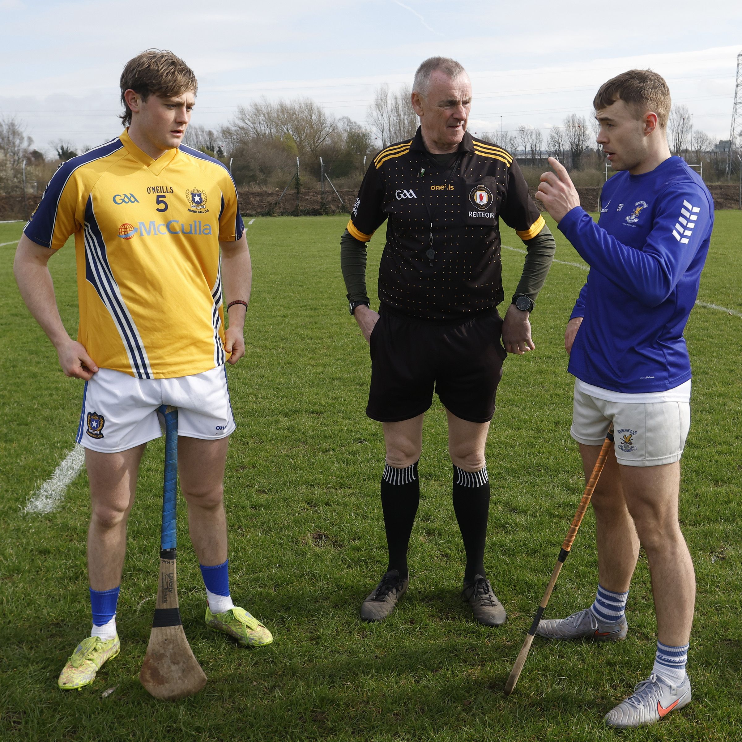 Captain's Gaireac Adams and Sean Wilson meet with referee Fintann McCoitter