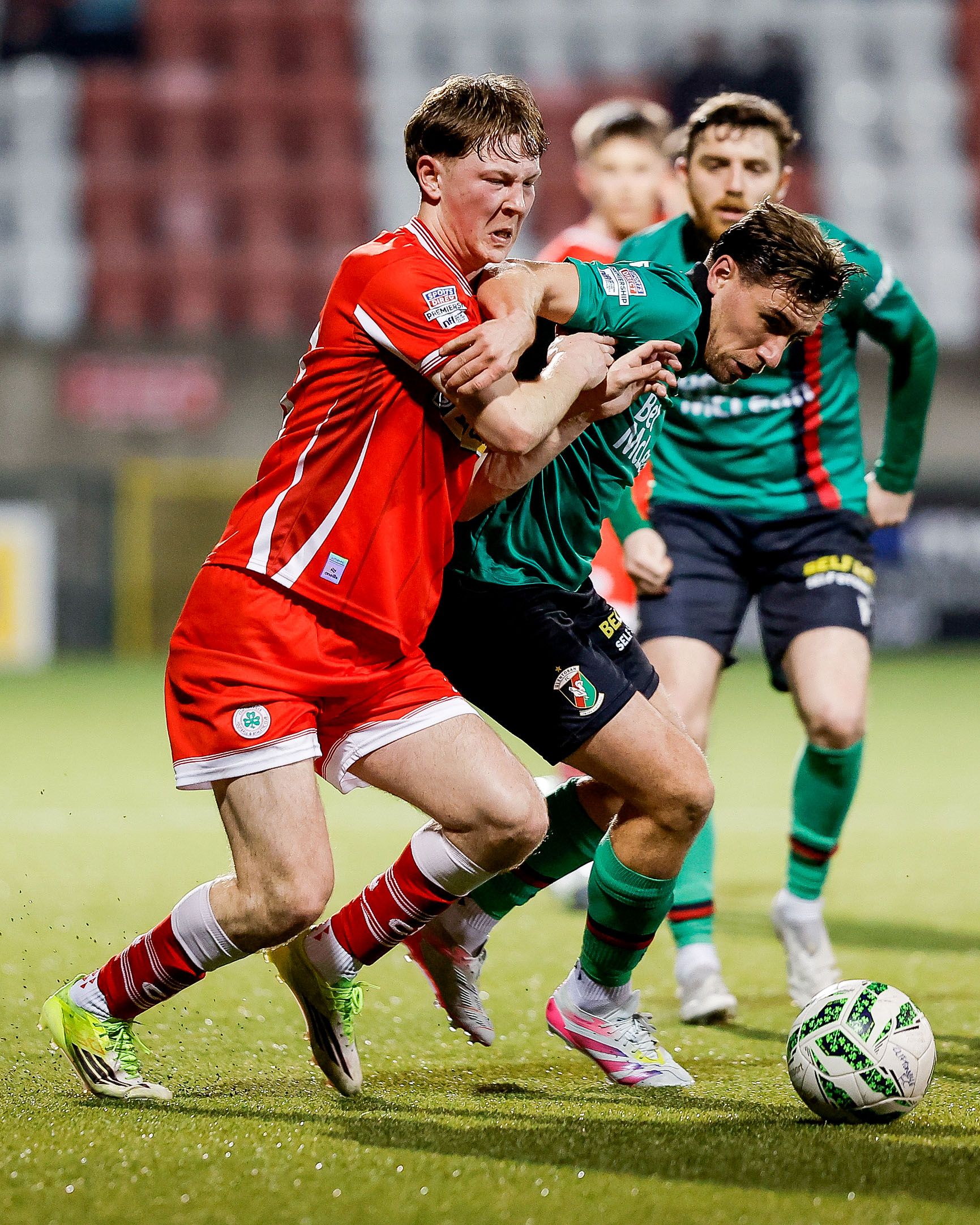 Cliftonville’s Michael Glynn battles with Joe Thomson of Glentoran