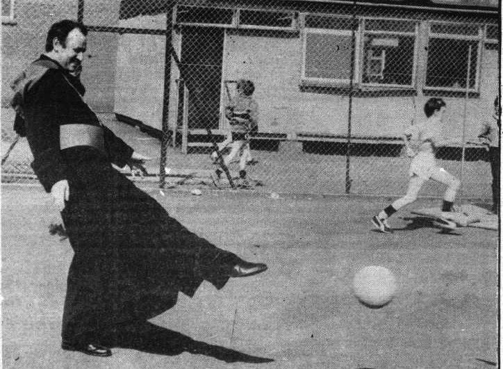 STILL GOT IT: Bishop Anthony Farquhar couldn’t resist a kick-about when visiting La Salle Secondary School