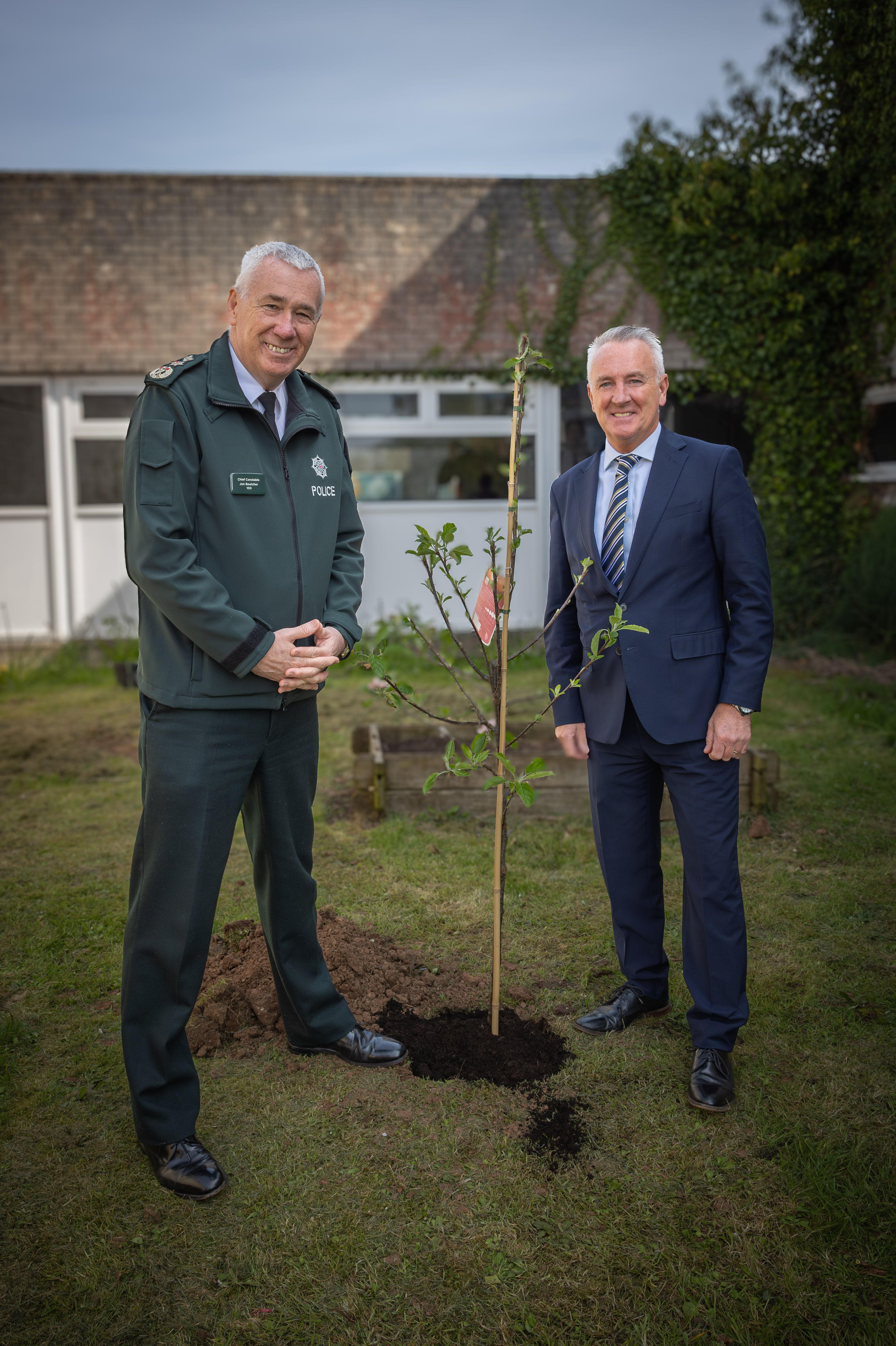Chief Constable Jon Boutcher and headmaster Adrian Walsh after planting an apple tree within the grounds of St Colm’s High School