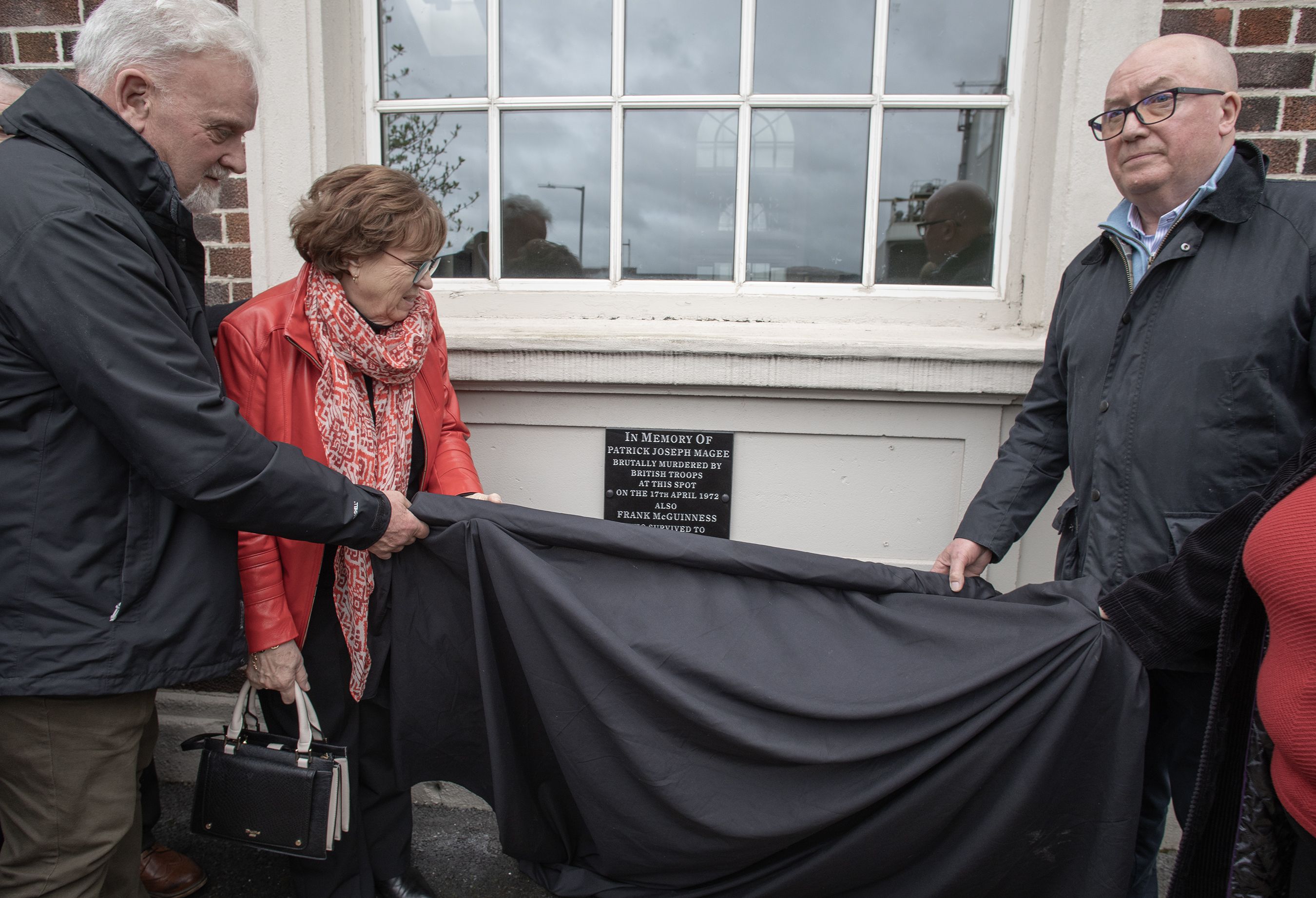 Patrick's family unveil the plaque at St Comgall's