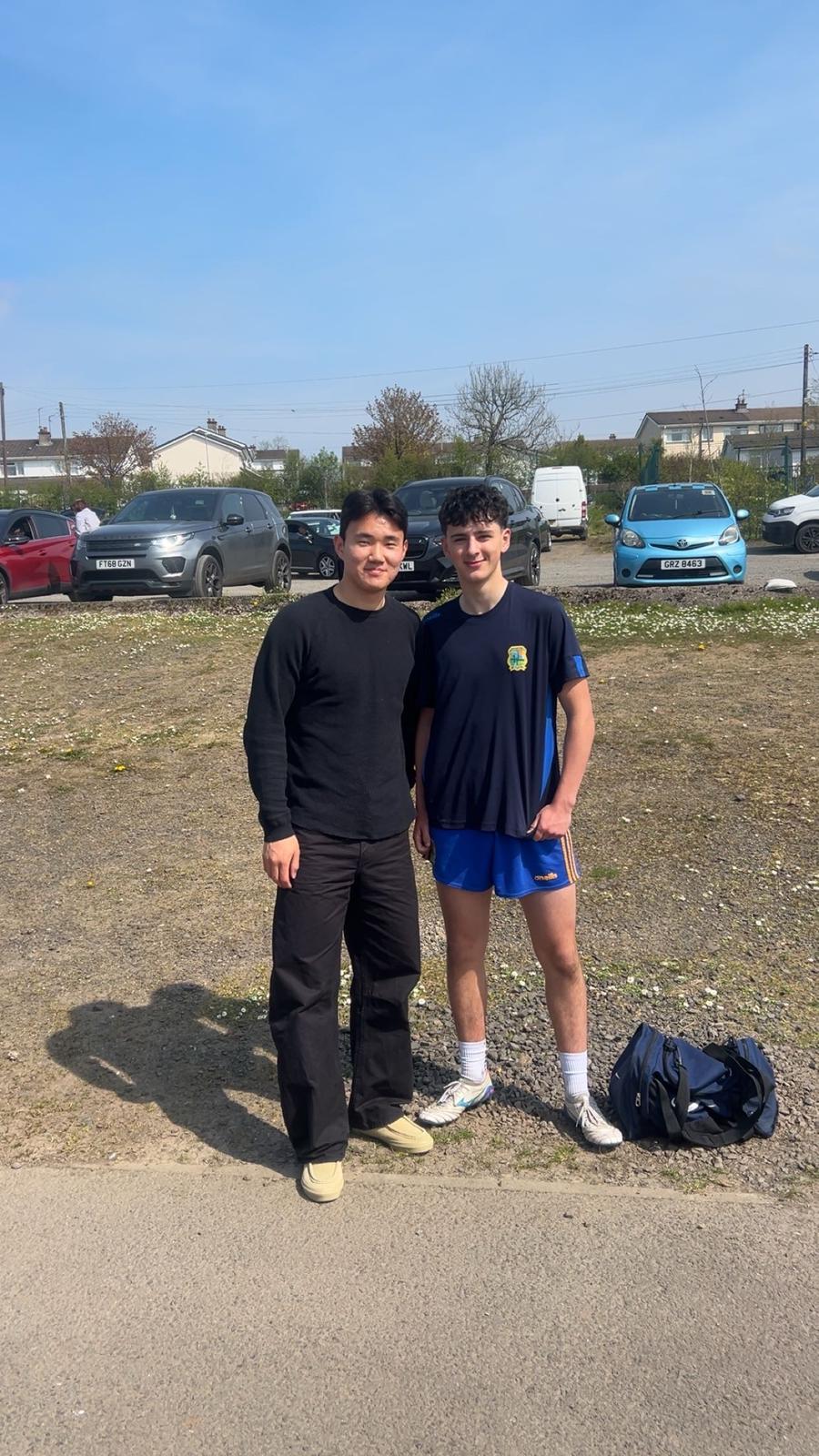 Yang with a young minor footballer from St Brigid's