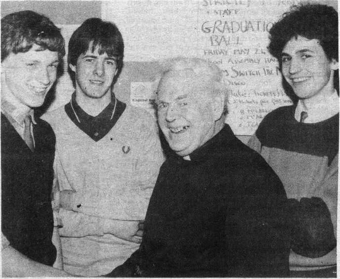 TOP MARKS: Damien, John and Paul congratulated by Brother Lynam