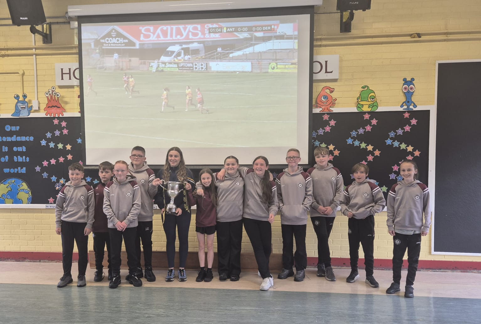 Holy Child Primary school with the trophy