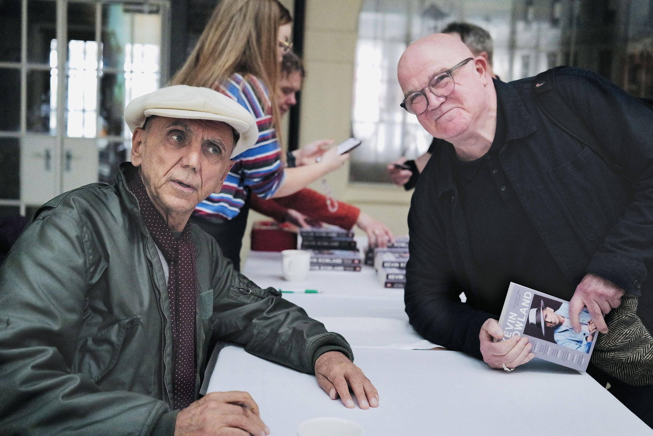 Kevin signs music journalist Stuart Bailie's copy of his autobiography