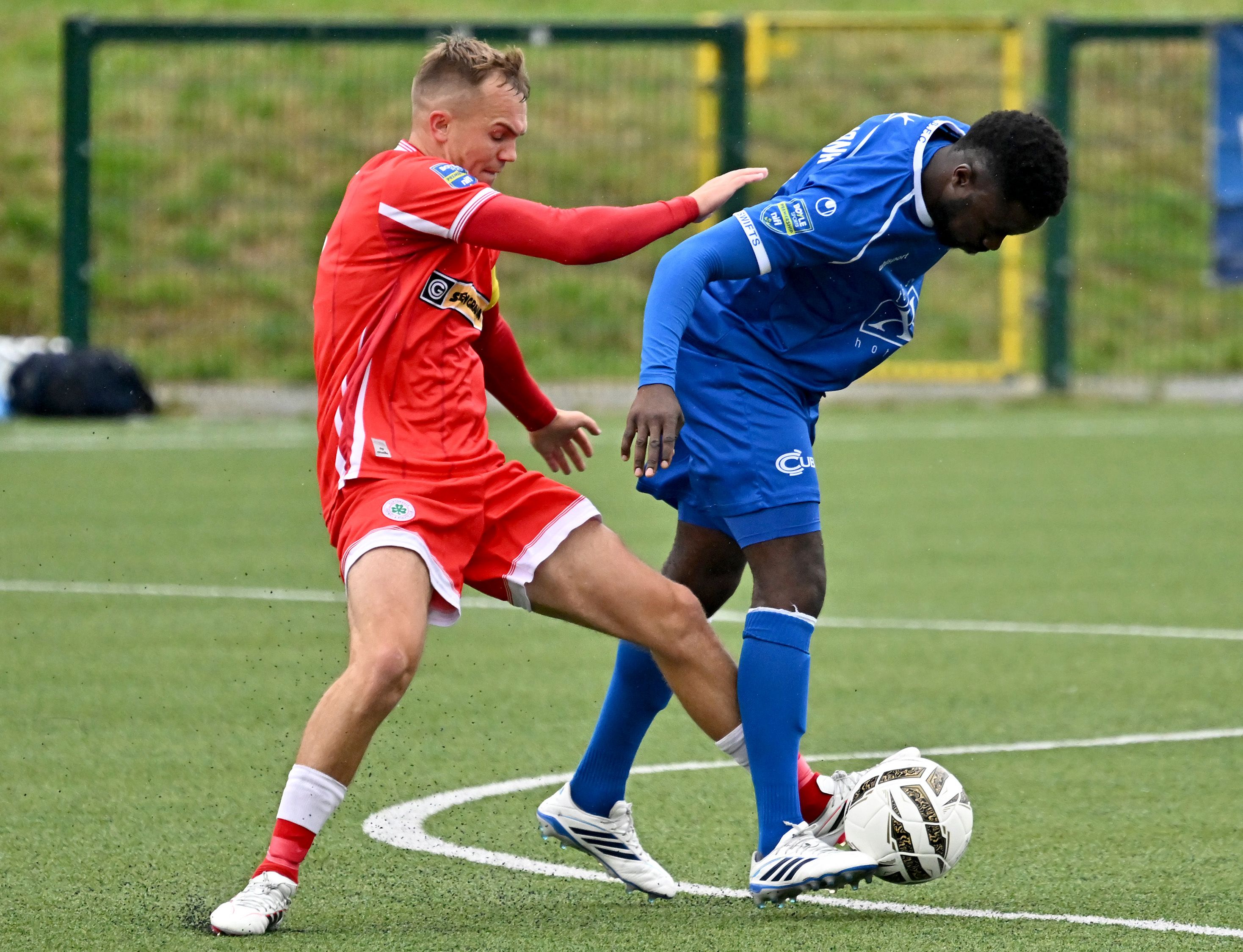 Rory Hale battles for possession with Gael Bigirimana