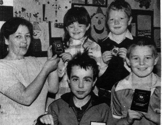 The Falls Swim Centre concluded its Summer Scheme back in 1985 with a party and prizegiving. Leader Frances Murphy presented Tracy McDonagh (Art), Bernard McKeamey (Art), Ciaran McAdam (Swimming) and Michael McCrory (Story) with their prizes