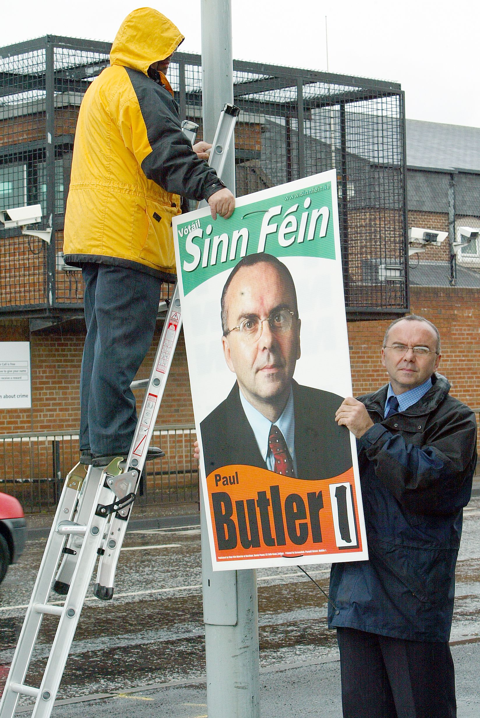 ELECTED REP: Replacing Westminster election posters torn down outside Dunmurry police station in 2003