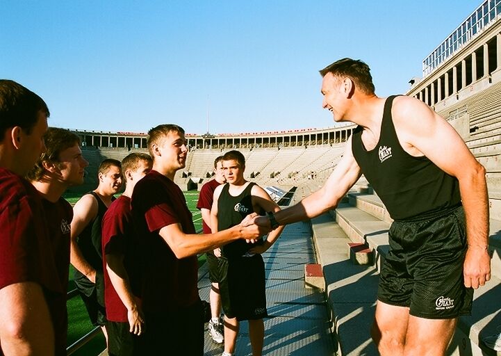 TRACKS OF MY TIERS: Larry O'Toole in Harvard Stadium with new-hires