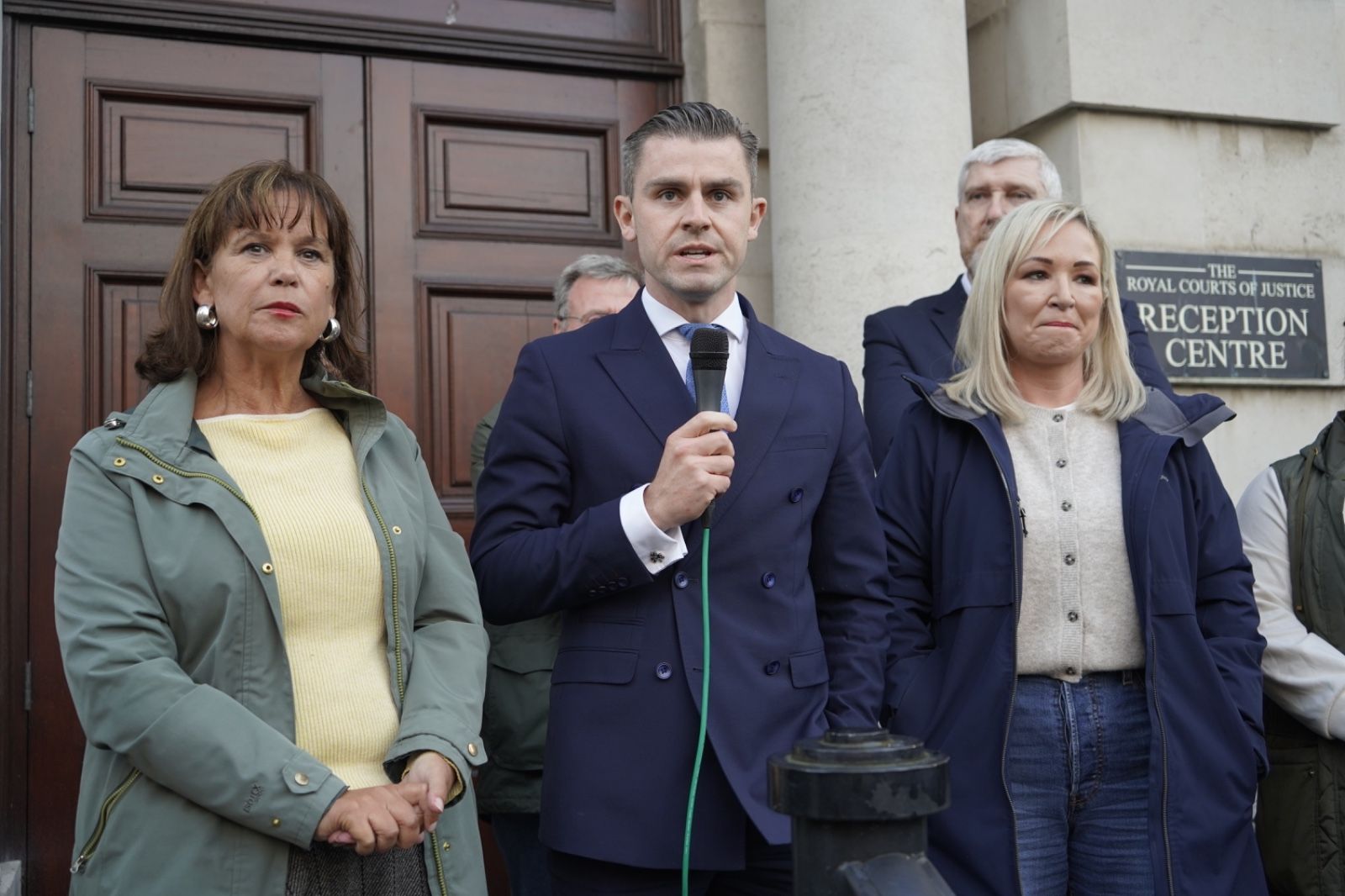 Solicitor Darragh Mackin addresses the crowd, with Sinn Féin's Mary-Lou McDonald and Michelle O'Neill