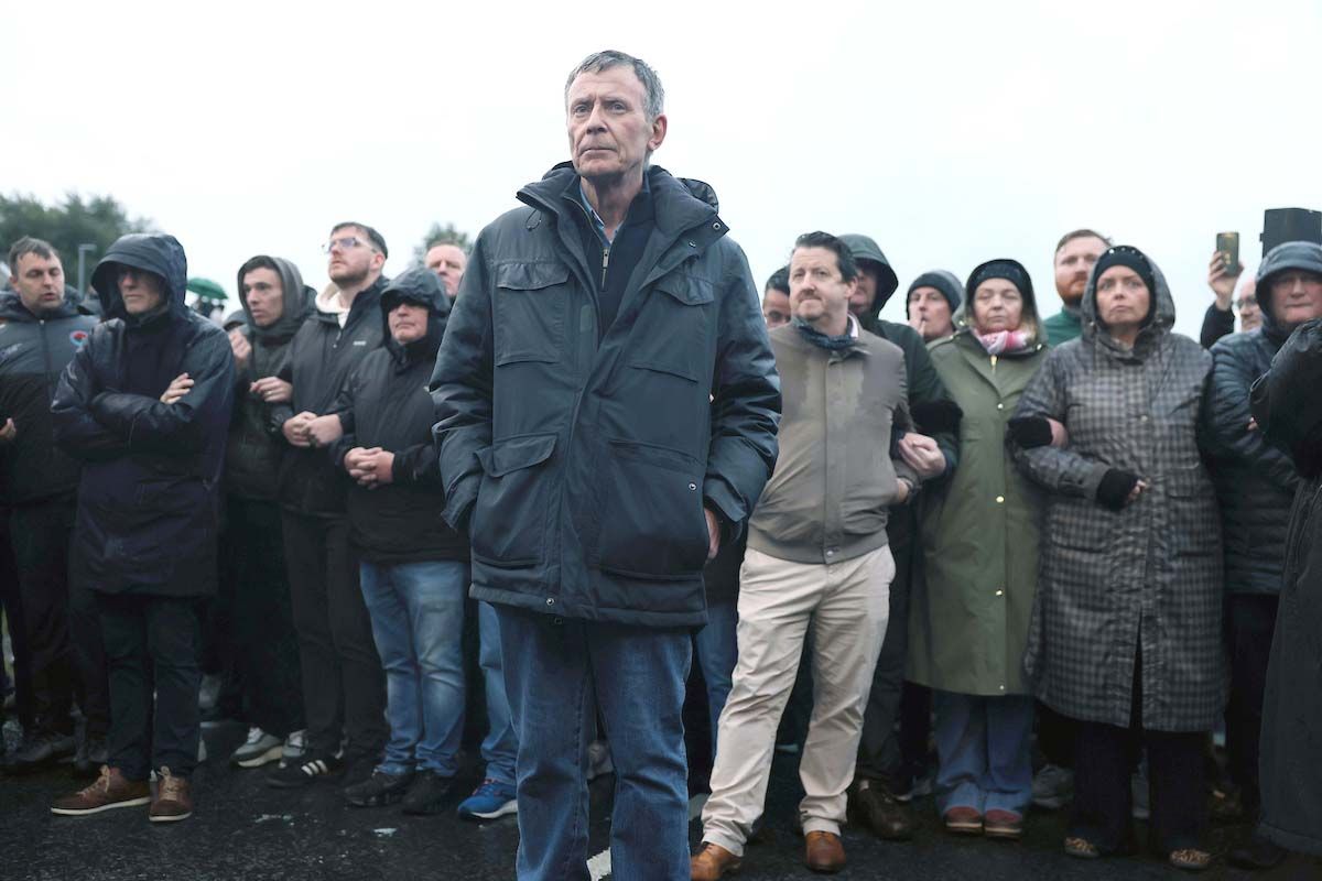 Breandán Mac Cionnaith with protesters on the Garvaghy Road on Sunday