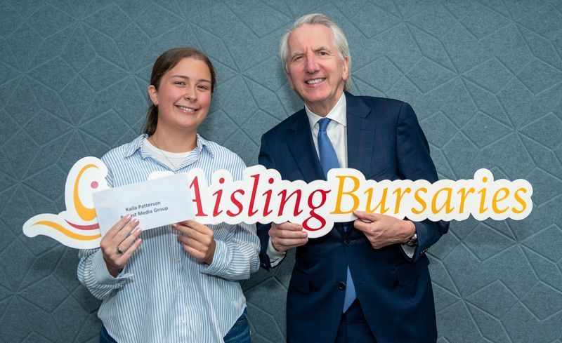 Kaila Patterson with Máirtín Ó Muilleoir. Kalia read a poem during the evening and this week also received an Aisling Bursary