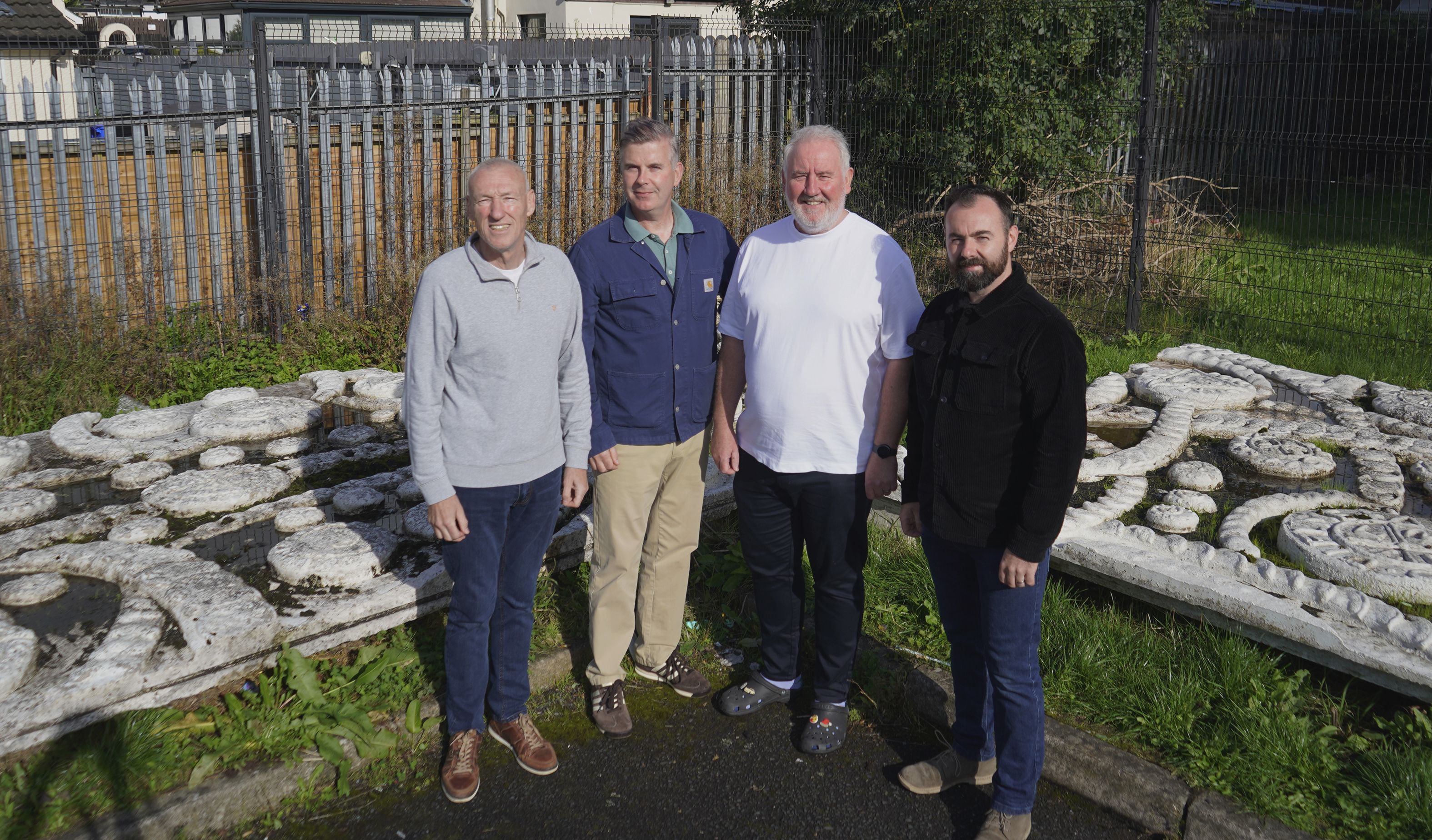 Marty Lynch from the PD, with Stevie Corr, Principal of Bunscoil an tSléibhe Dhuibh, Pilib Mistéil, and architect Ciarán Robinson