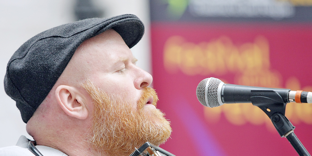 Joby Fox singing at the launch of Féile 2013