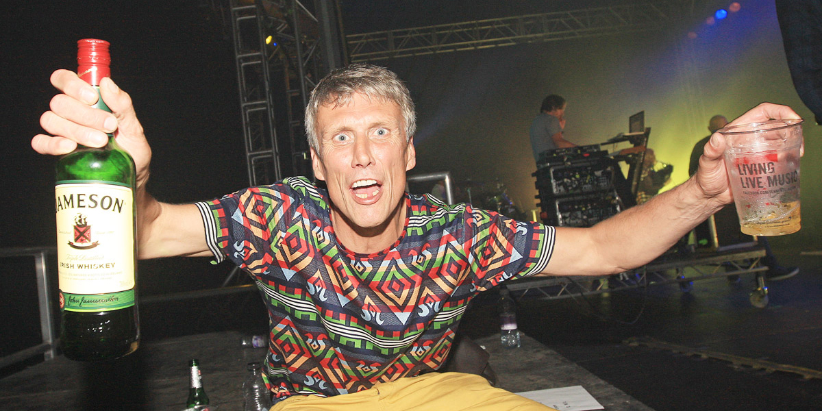 Bez takes a break backstage as the Happy Mondays pump it out in the Big Top