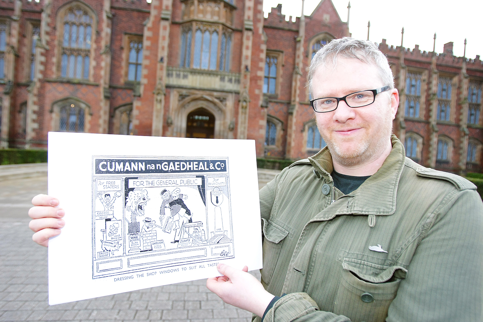 Barry Sheppard with one of the cartoons from his exhibition, which focuses on the economic and political dynamics of 1930s Ireland