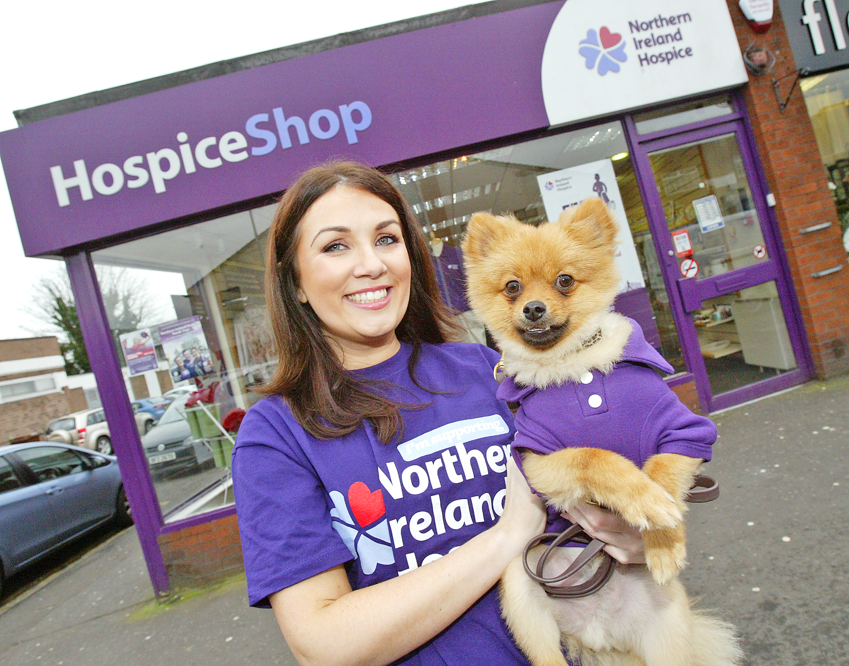  Emma Montgomery at the Finaghy Hospice shop with her Pomeranian Leo, who has put paw to paper to sign up for the Hospice walk