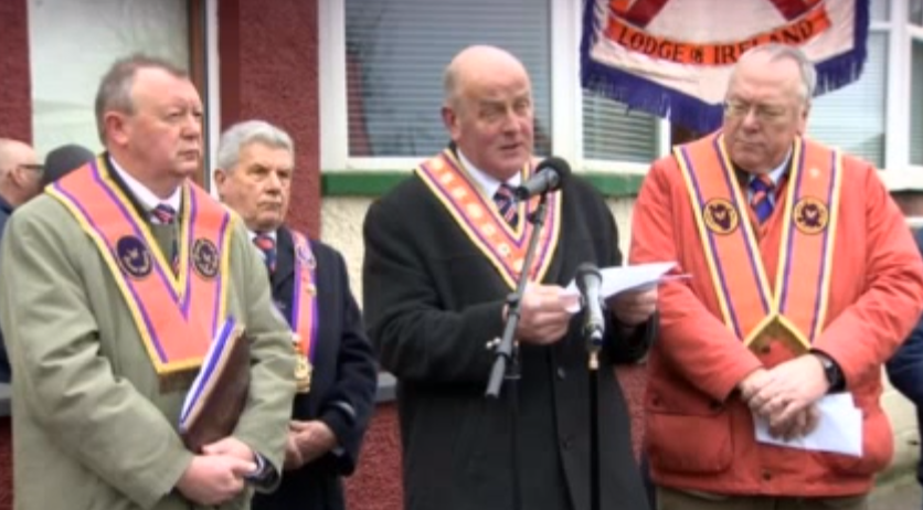 Grand Master Edward Stevenson speaking at Woodvale on Saturday, surrounded by other senior officers of the Orange Order 
