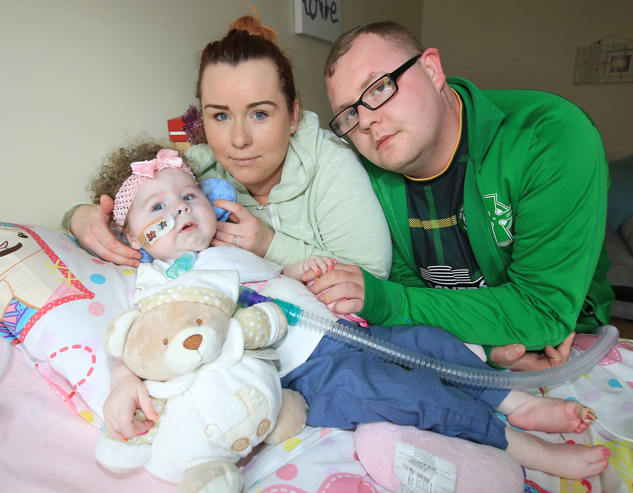 Caoilte Fitzsimons with her parents Robert Fitzsimons and Fiona Murphy. They\'ve been left distraught after an internet troll directed vile abuse at their baby girl 