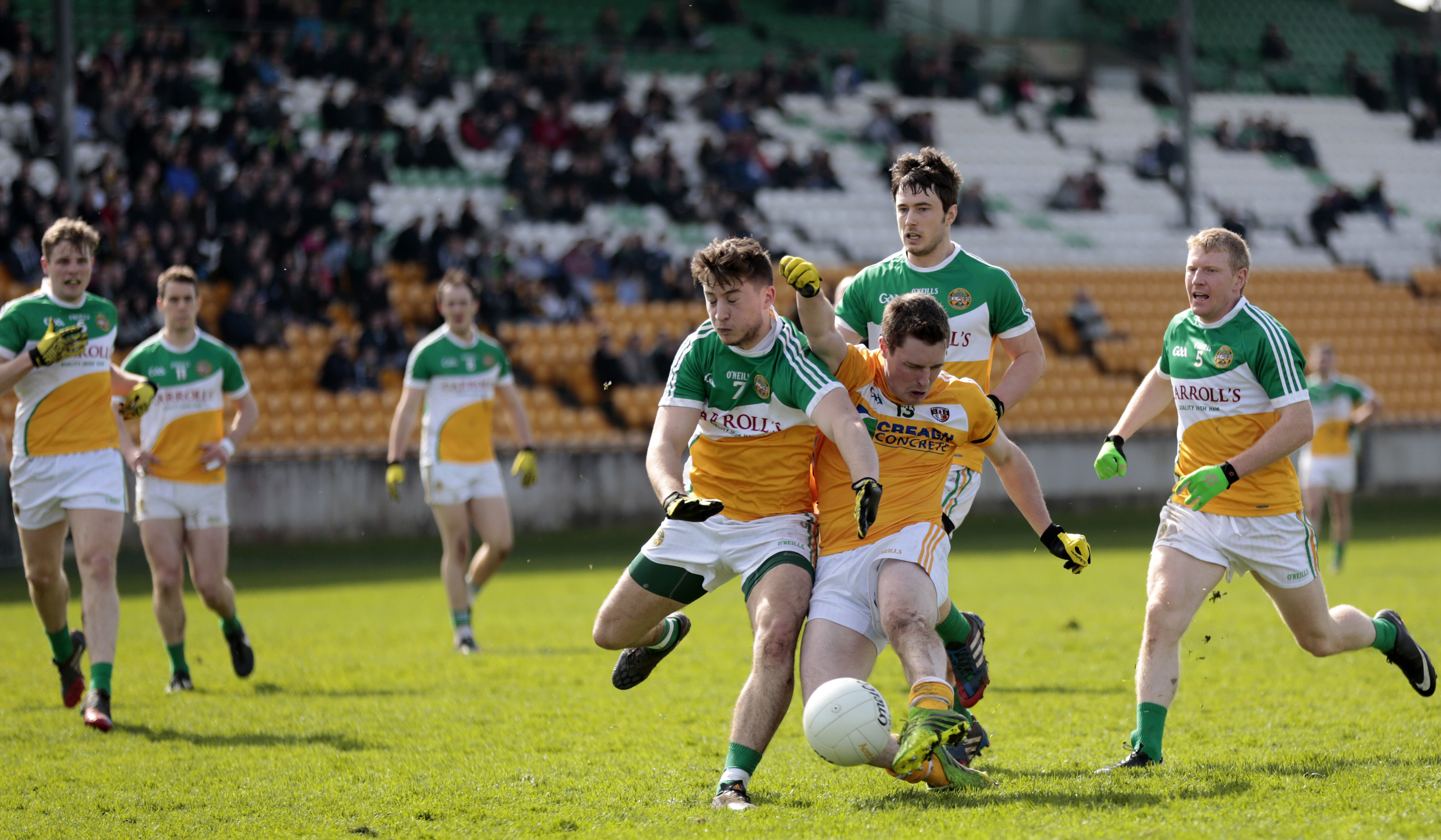 CJ McGourty is outnumbered by 7 to 1 as he goes for goal during the second-half of Sunday\'s NFL Division 4 game in Tullamore.