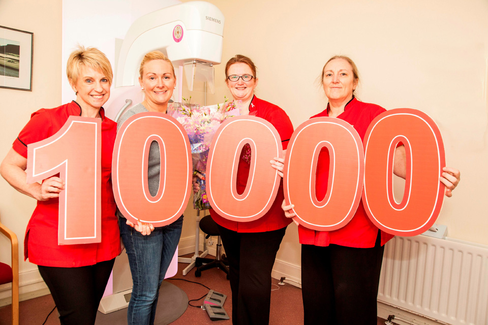 Dunmurry woman Angela Maxwell, second left, is the 10,000th women to be screened for breast cancer by Action Cancer in the 2014/2015 year. With Angela are Action Cancer Radiographers Sharon McCollum, Joanna Currie and Liz Taylor