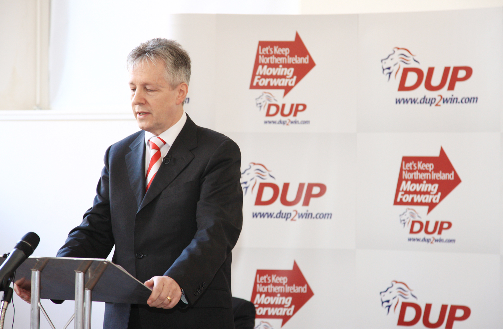 Peter Robinson recovers in hospital from a suspected heart attack