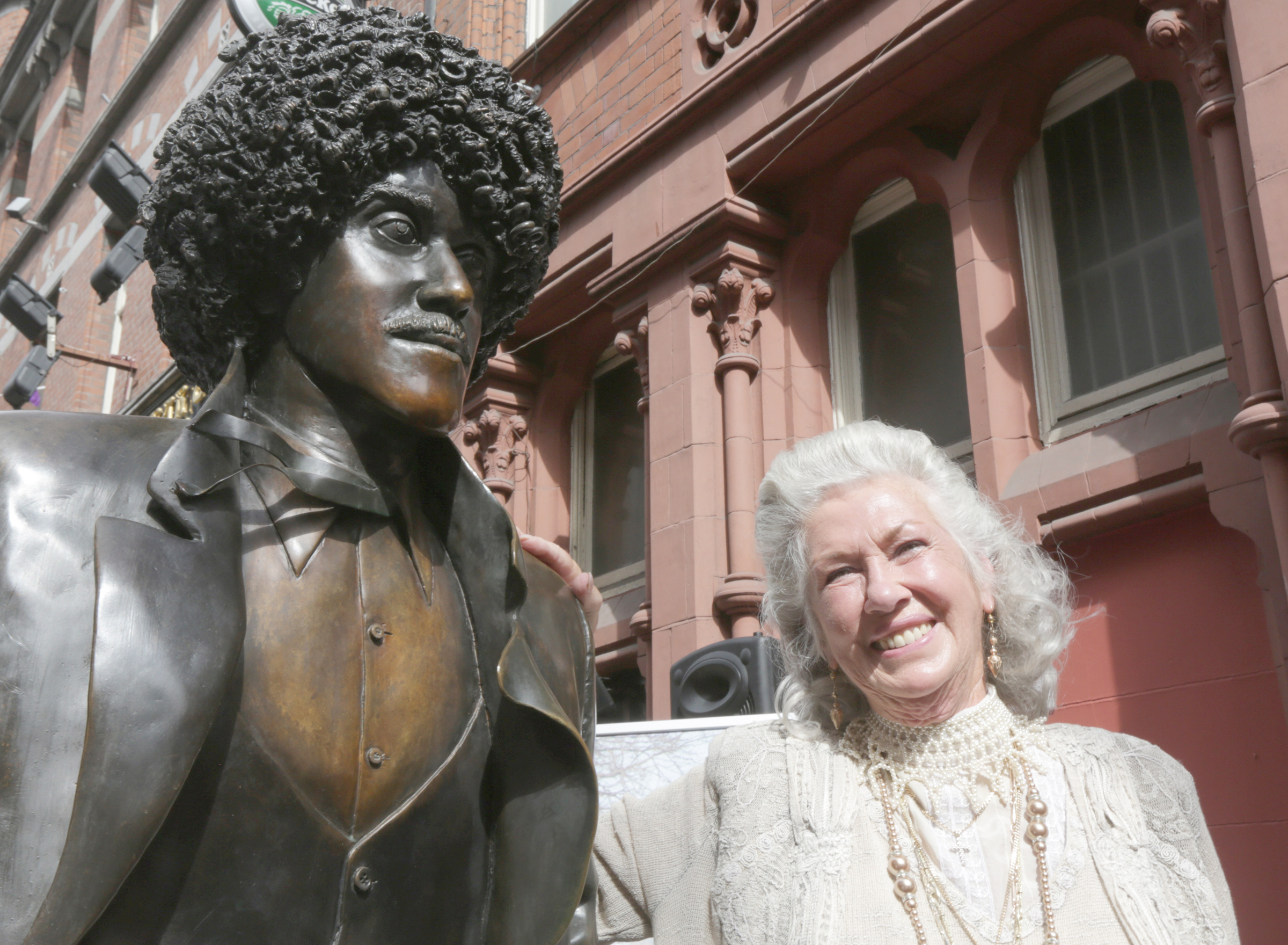 Philomena Lynott at the statue of her son Phil in Grafton Street