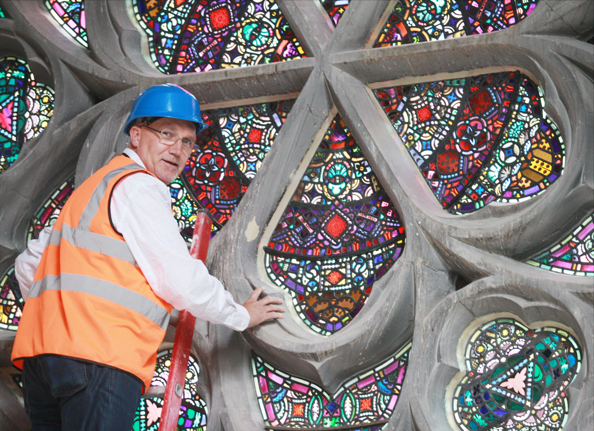 Rev Bill Shaw at the Duncairn Centre window that so intrigued a visitor