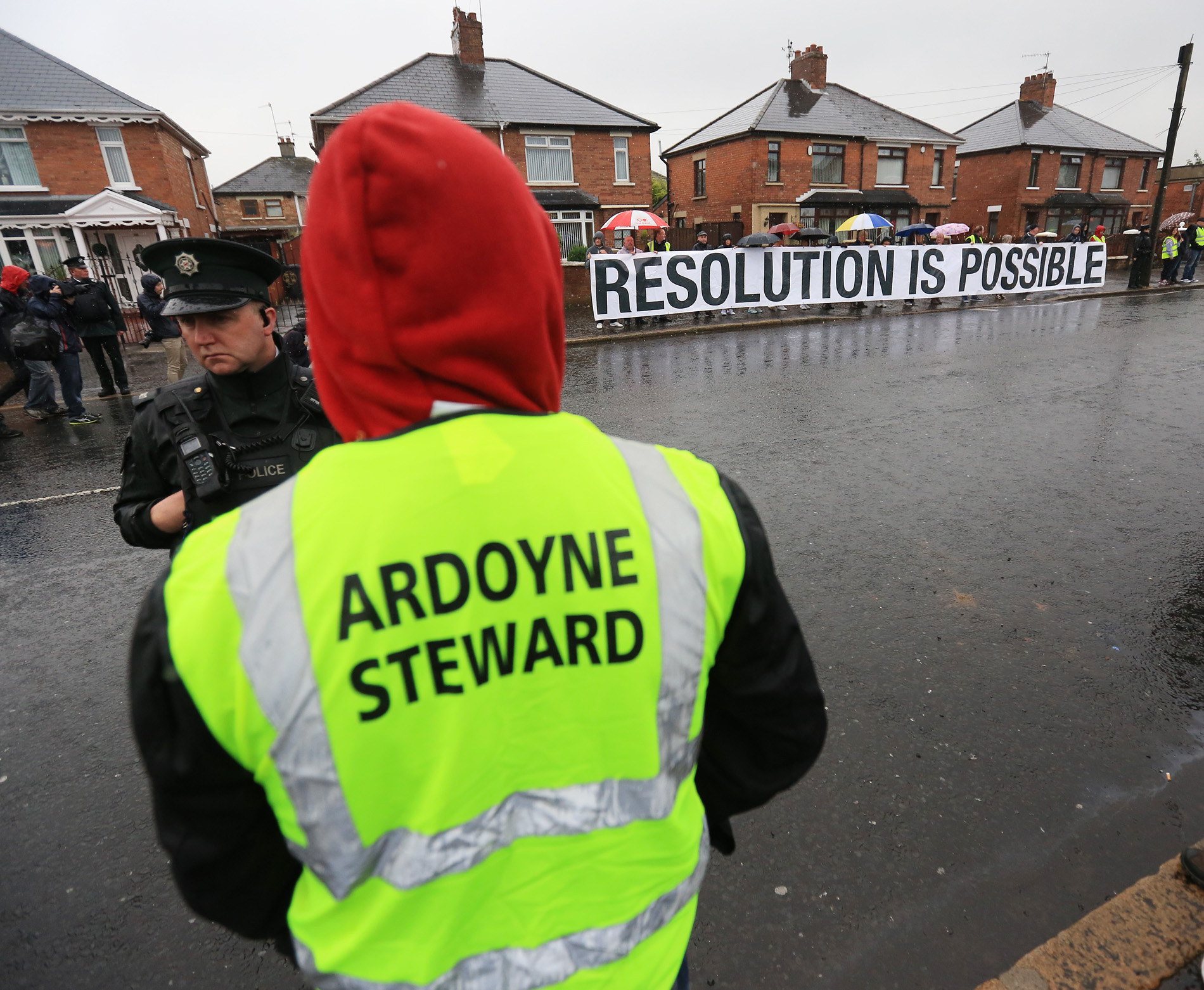 Peaceful protest as Orange bands march past Catholic homes in Ardoyne this morning