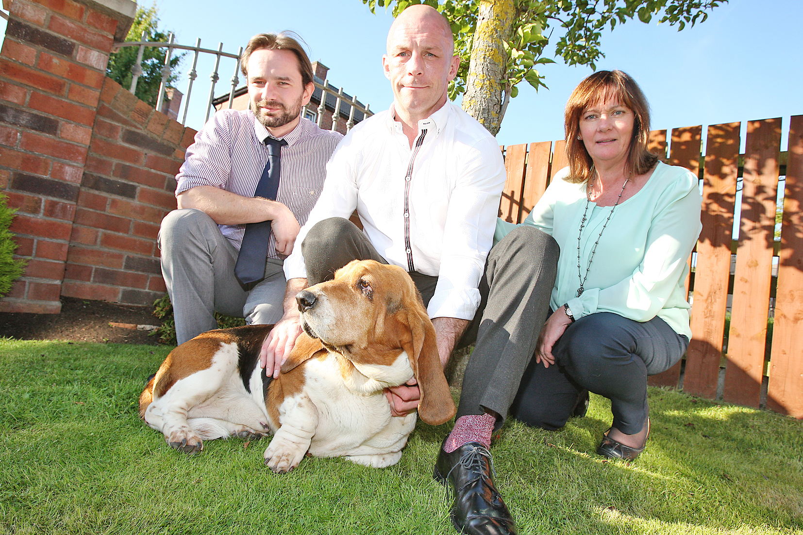 Rossa the Basset hound with his owner Tommy Tolan, centre, Cllr David Bell and Jennifer McCann MLA