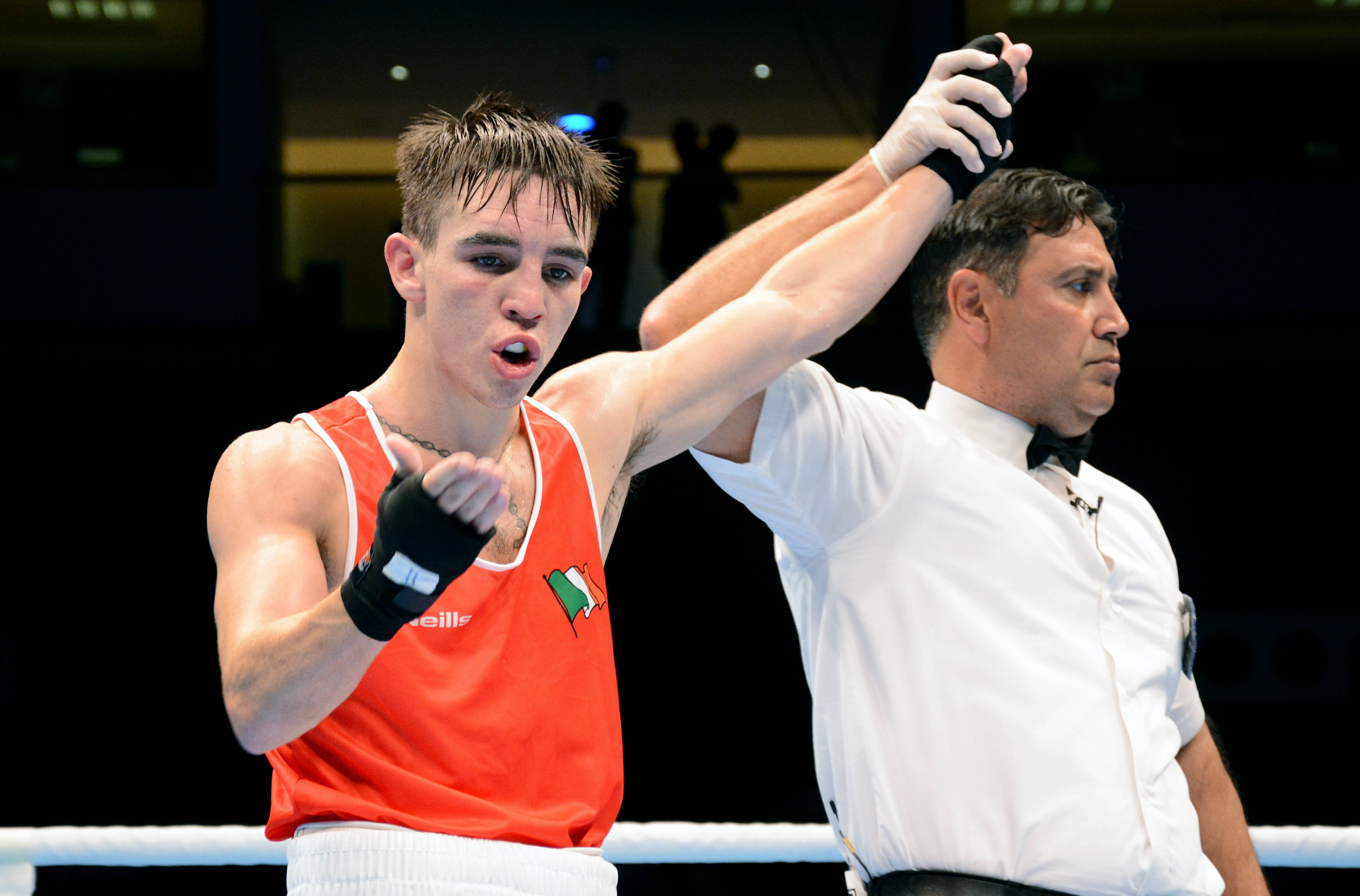Michael Conlan’s hand is raised after he claimed a unanimous points decision against Belarus boxer Dximitry Asanau
