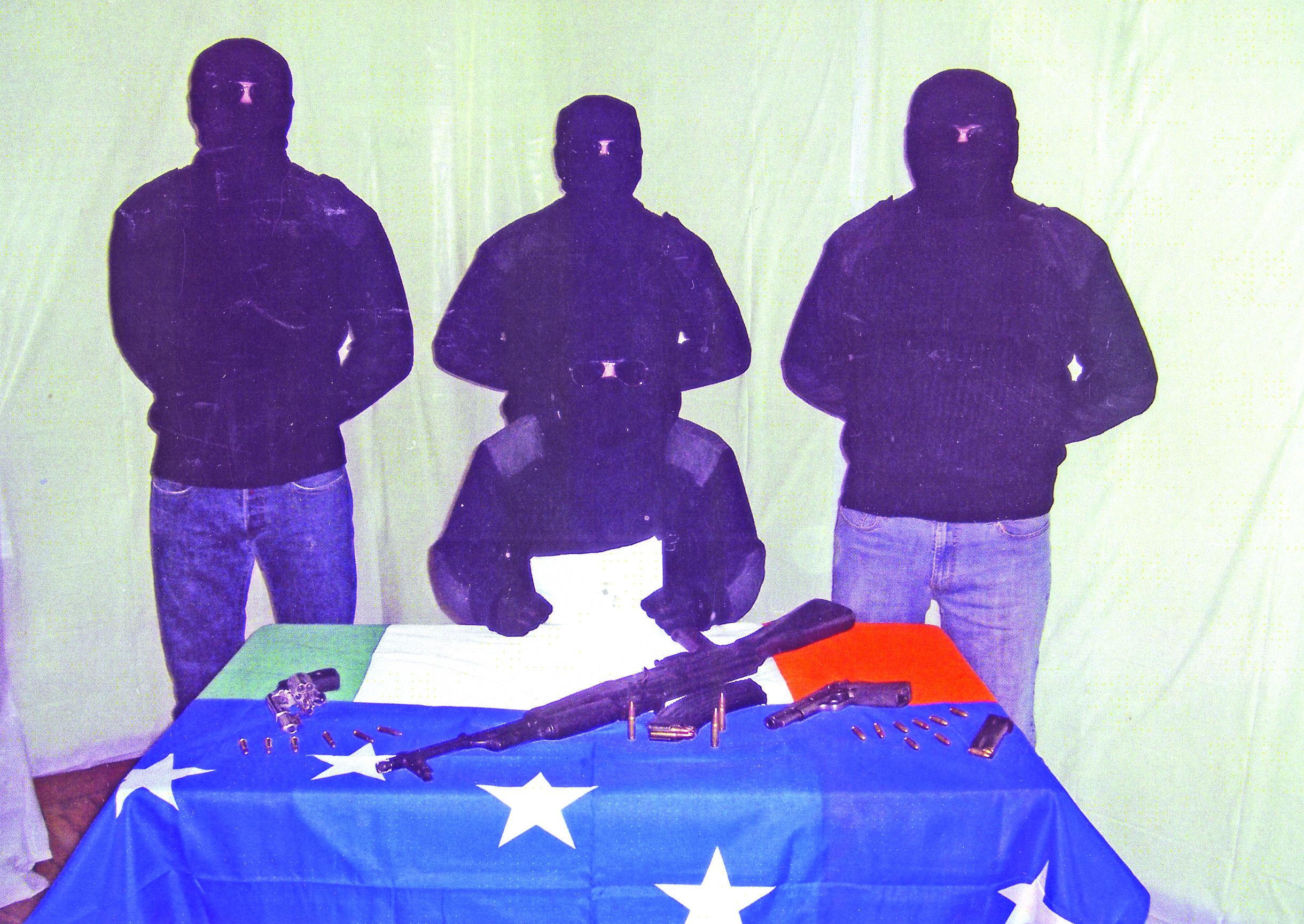 Members of the new group with weapons – one of the flags on the table is the Starry Plough as it’s believed the gang has ties to the INLA 