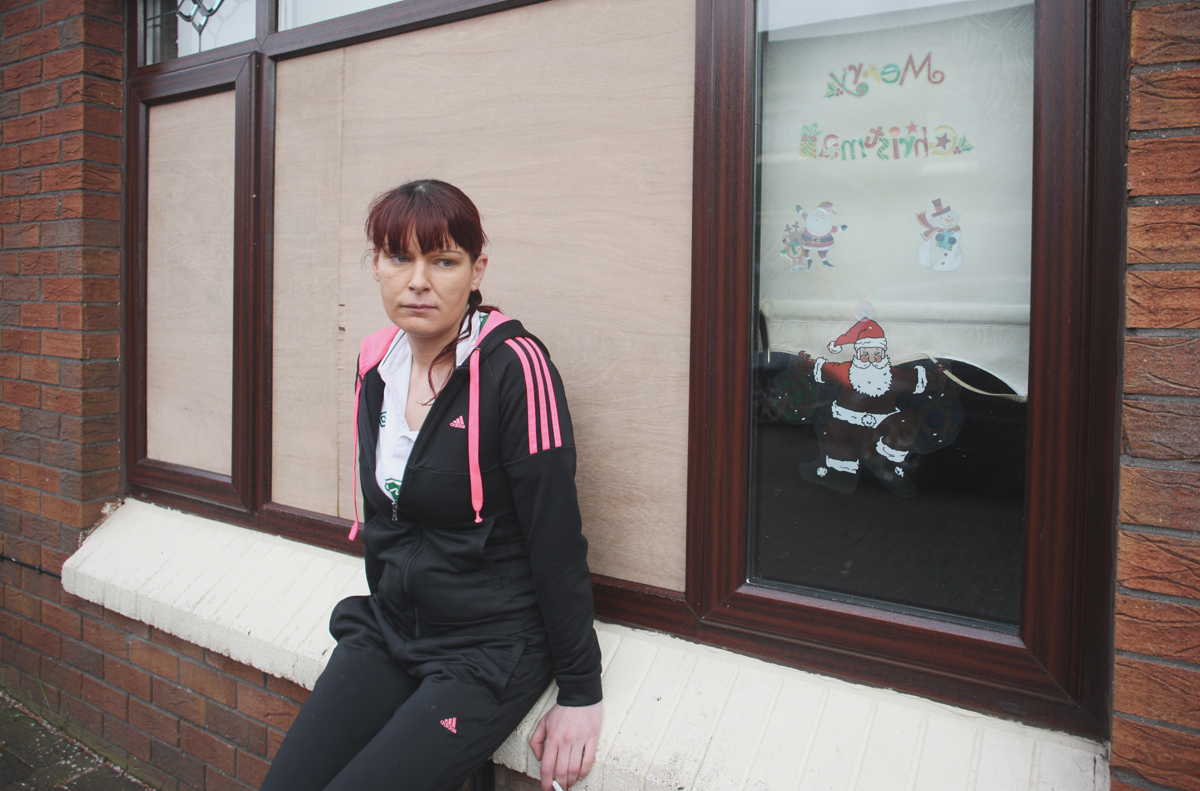 Chantelle Collins outside her Oldpark home where she was threatened by a masked gunman and ordered to leave the area