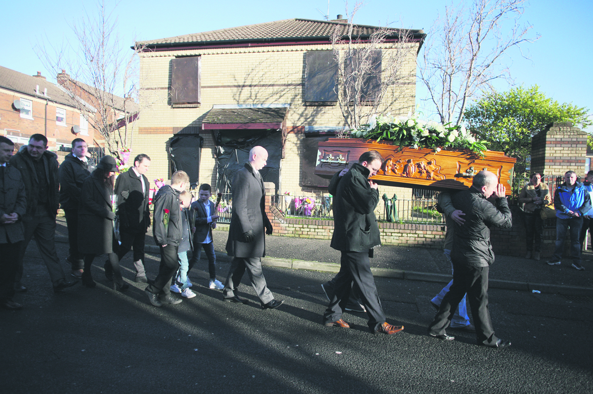 The funeral cortege of Conor McKee passes the Glenpark house where he was shot dead on January 7 